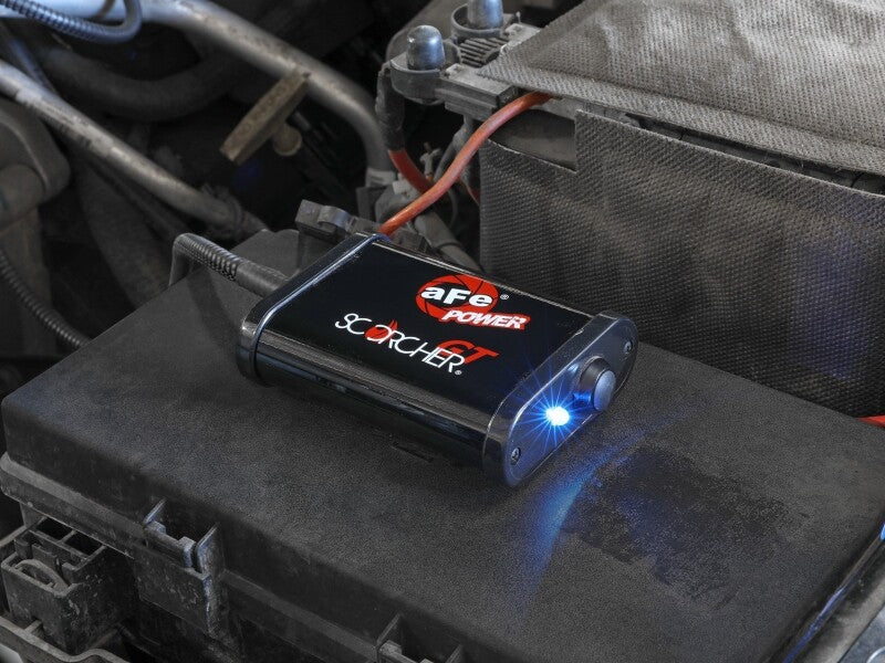aFe SCORCHER Power Module for Ford F-250/F-350 20-22 V8-7.3L installed on engine bay, enhancing performance and power.