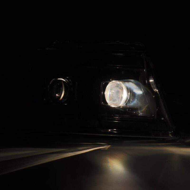 AlphaRex 04-08 Ford F150 Chrome LUXX Series Projector headlights showcasing a sleek design and bright illumination.