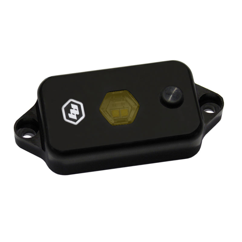 Baja Designs LED dome light with switch in amber color, featuring a sleek black housing and hexagonal lens design.