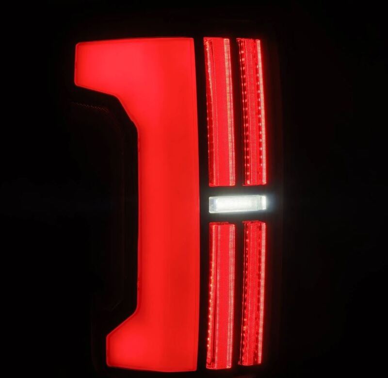 AlphaRex Nova-Series LED tail lights for 07-13 Toyota Tundra in black, featuring a sleek design with bright red illumination.