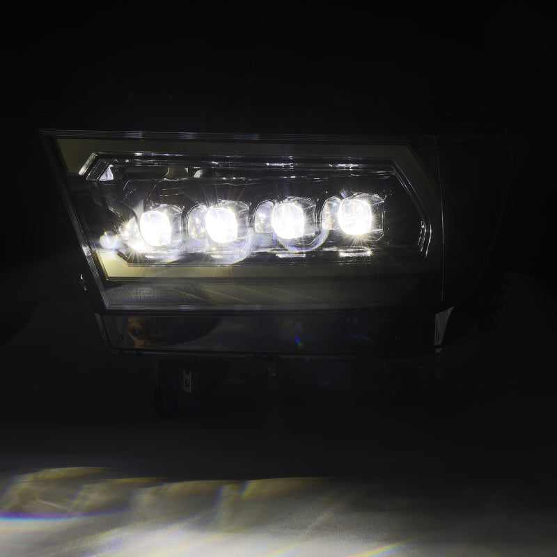 AlphaRex NOVA-Series LED projector headlights for 2019-2023 Dodge Ram 1500 in Alpha-Black finish, showcasing bright illumination.
