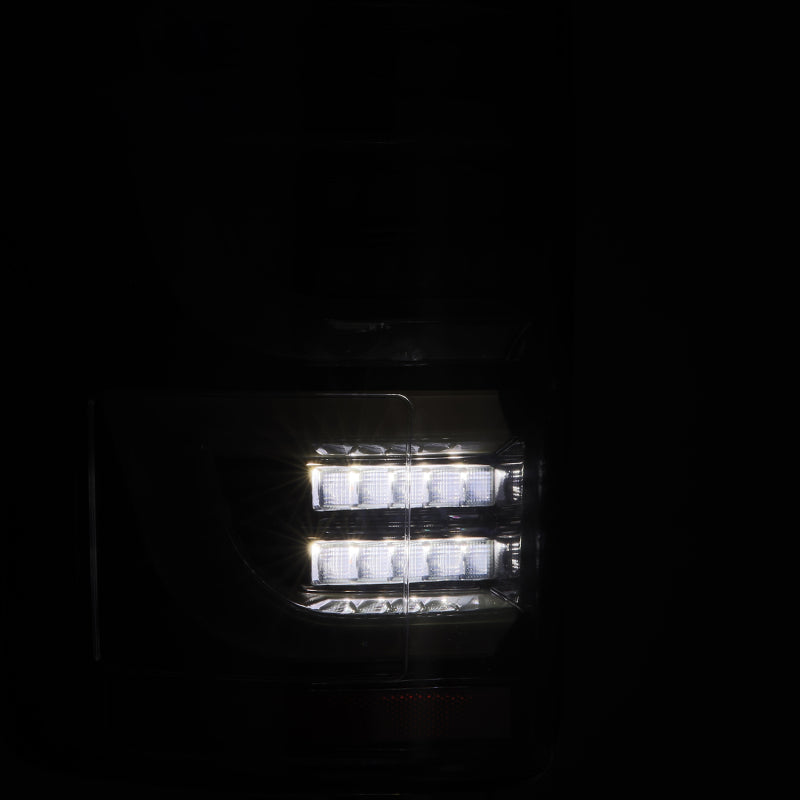 AlphaRex Luxx-Series LED tail lights for 15-20 Ford F150 in alpha-black, showcasing a sleek design with bright illumination.