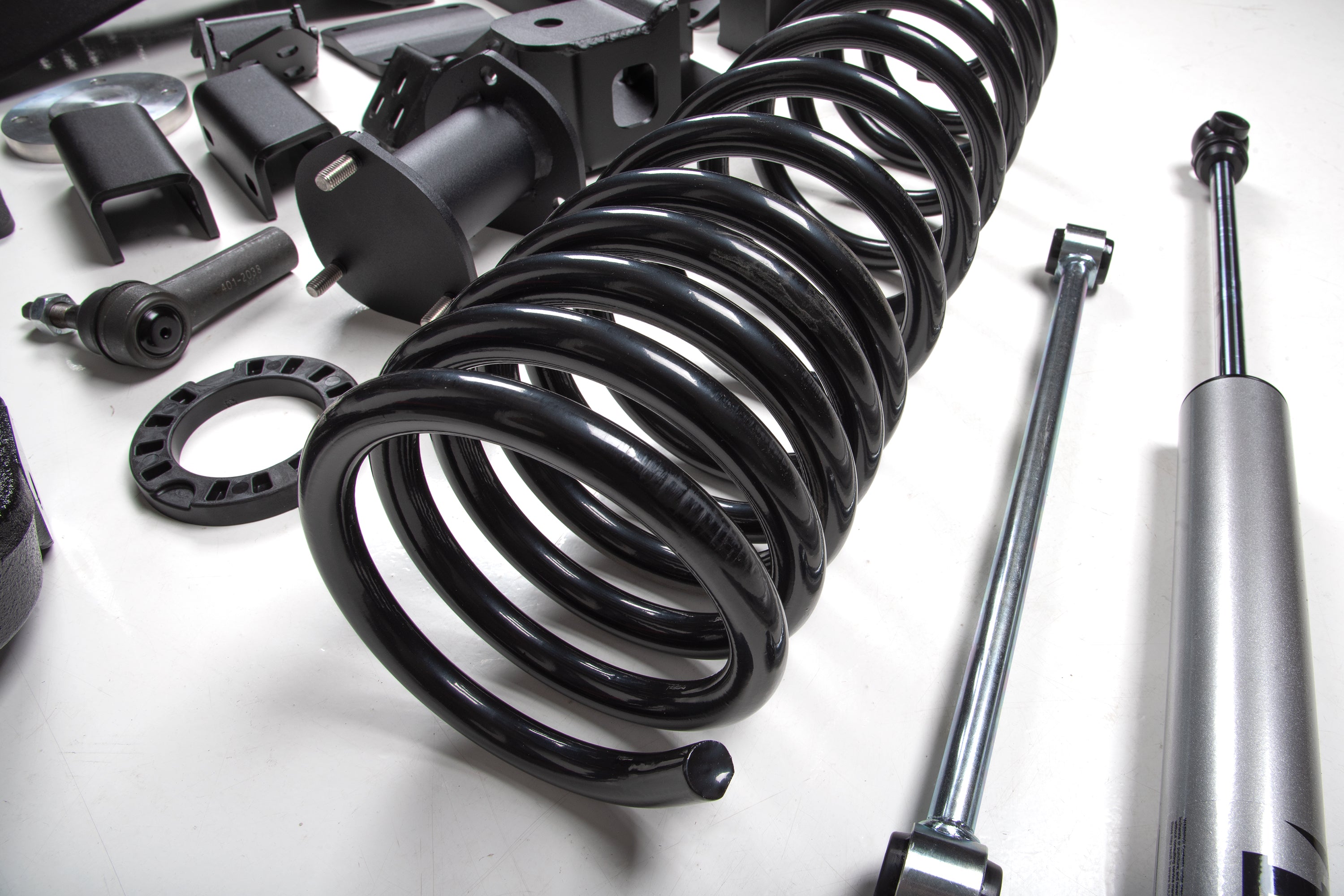4-inch lift kit components including FOX 2.5 coil-over shocks for Ram 1500 4WD, showcasing springs and hardware.
