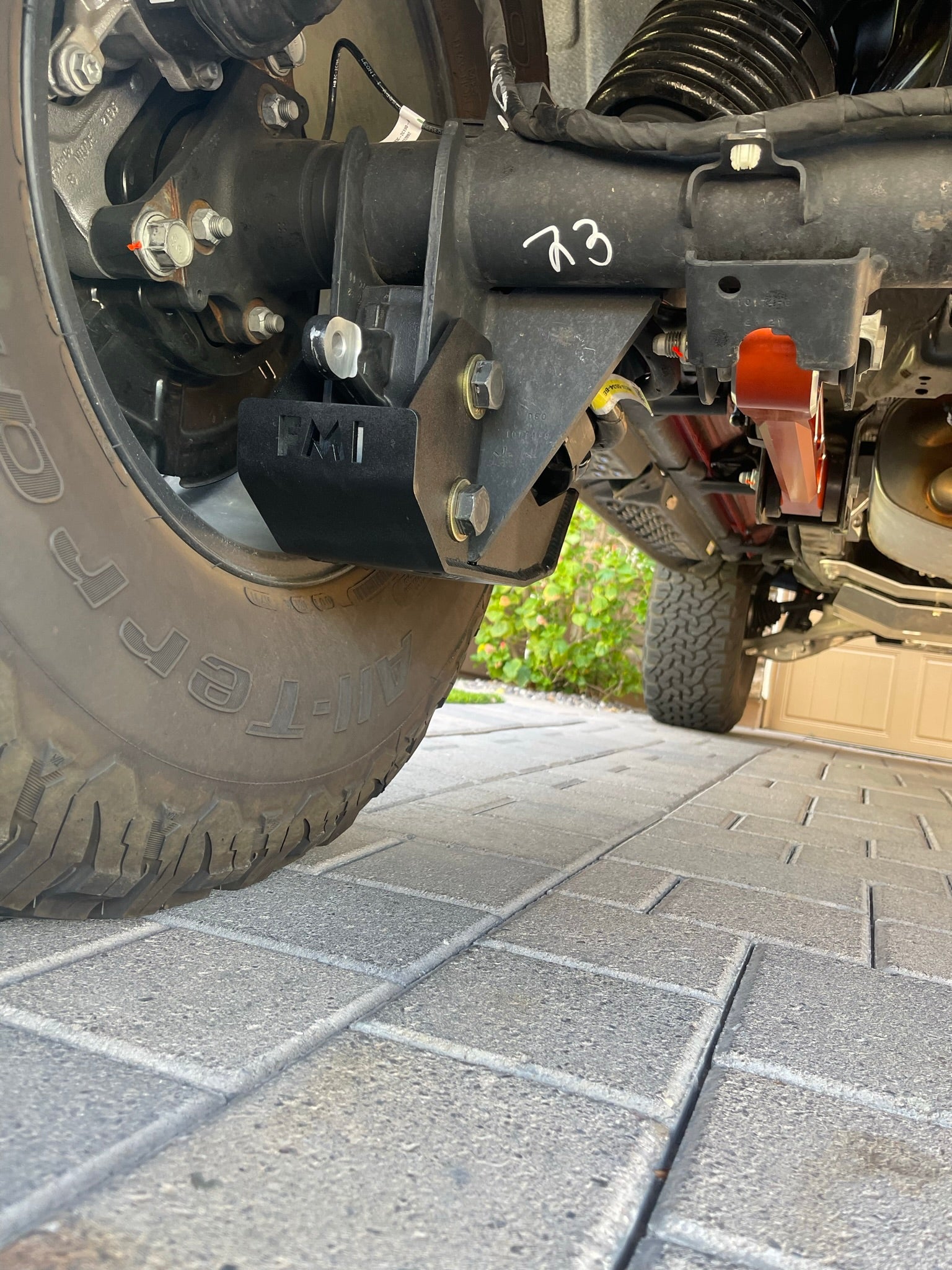 2022 and newer Bronco Raptor rear shock skid kit installed, showcasing durable protection under the vehicle's rear suspension.