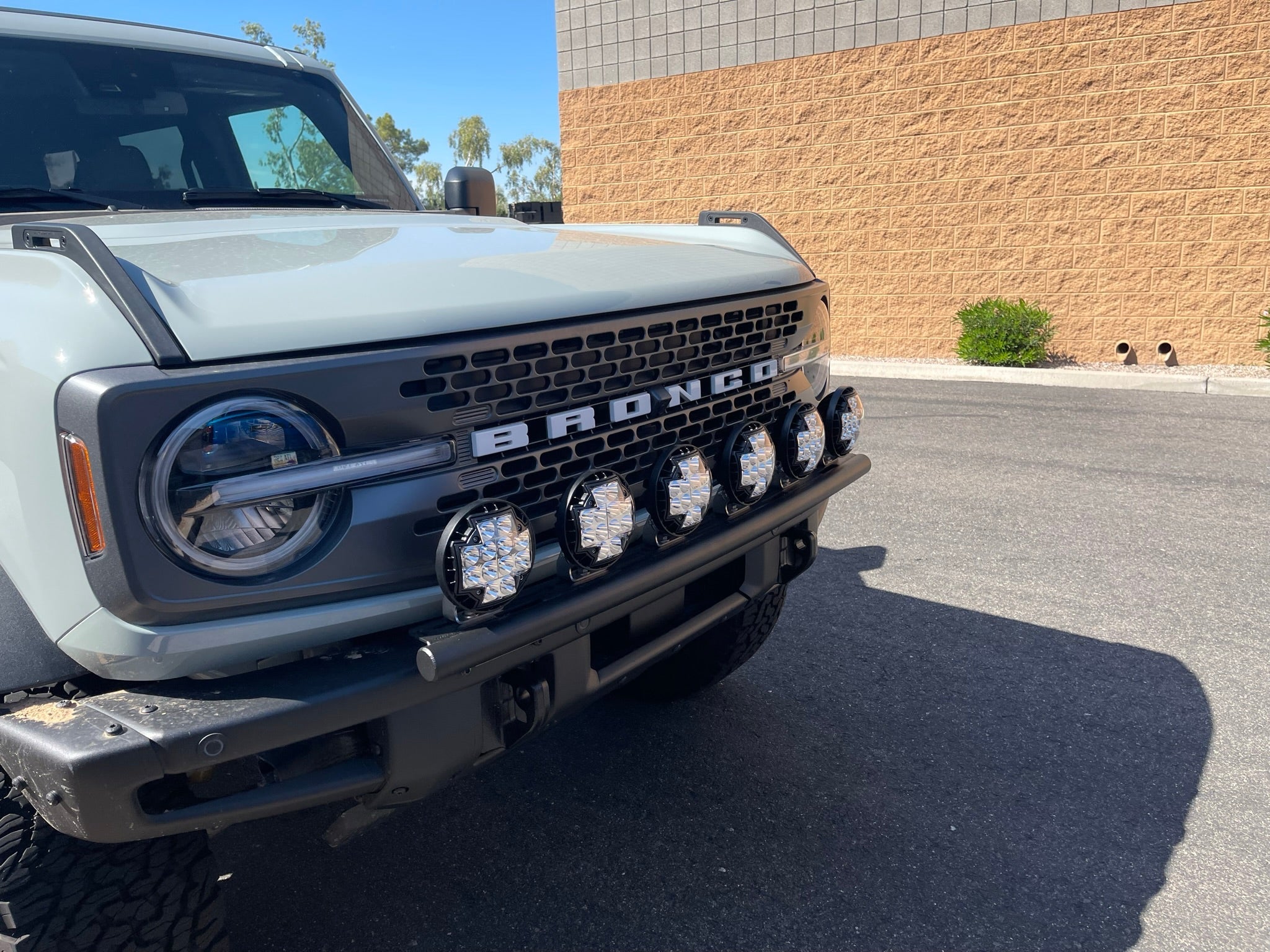 2022-UP Bronco Raptor Front Light Mount Kit showcasing a rugged front grille with multiple mounted lights for enhanced visibility.