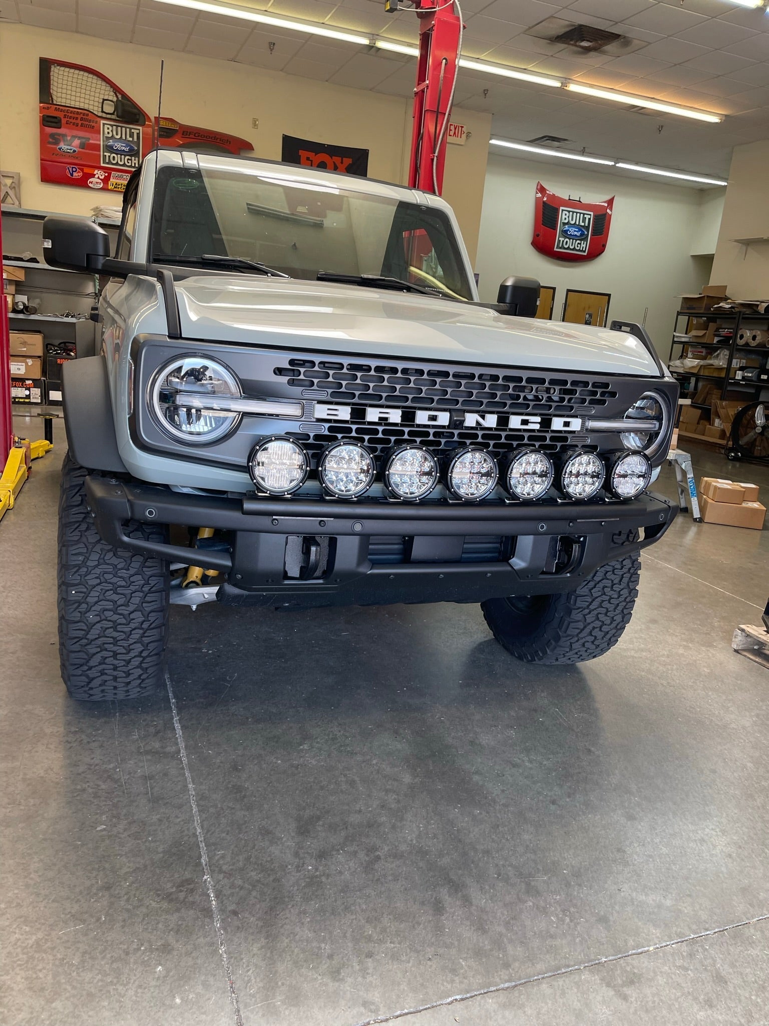 2022-UP Bronco Raptor Front Light Mount Kit displayed on a Bronco with multiple lights installed, showcasing offroad capabilities.