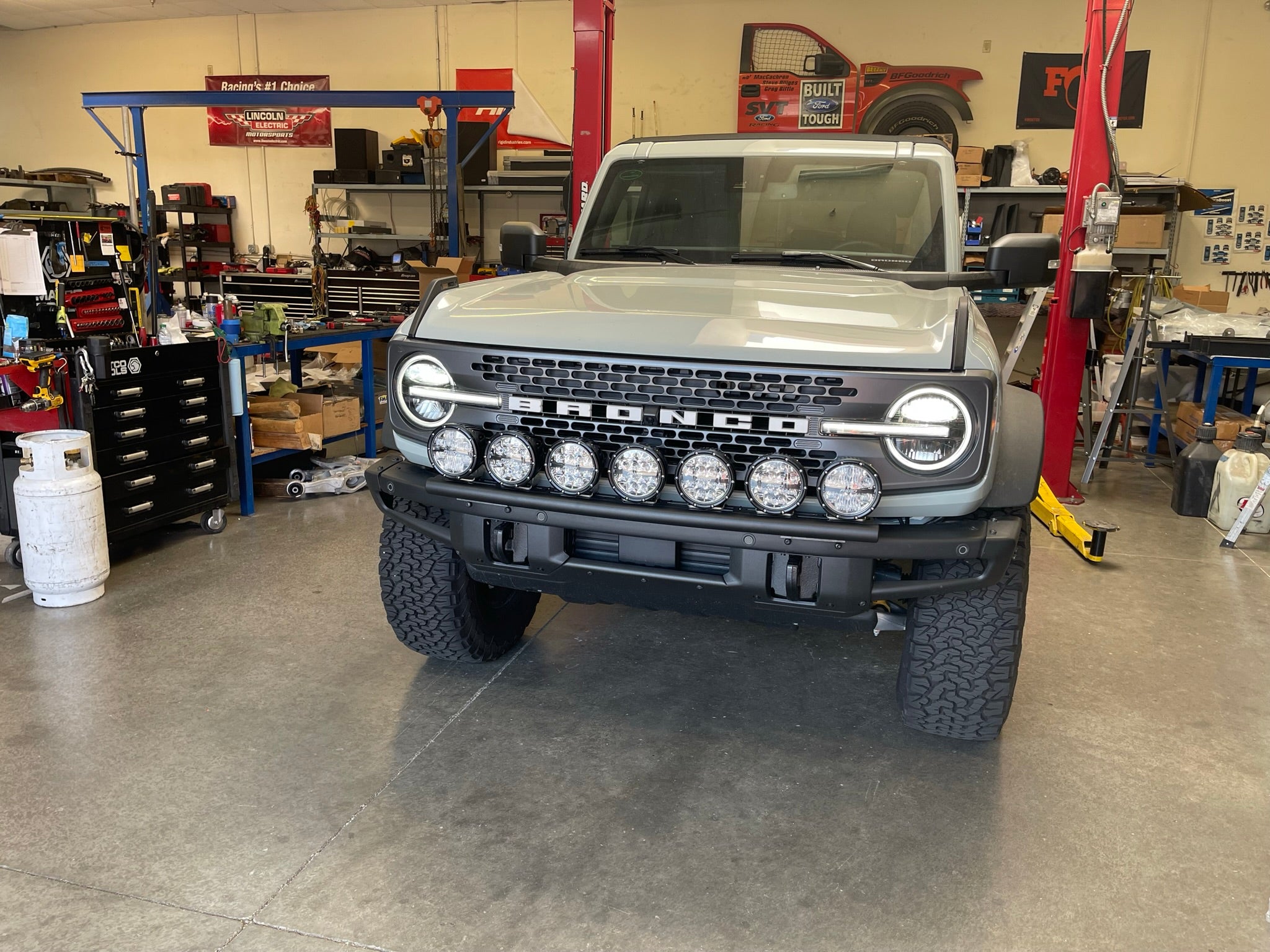 Front view of a 6th Gen Bronco equipped with a front light mount kit for the modular stock bumper, showcasing multiple lights.