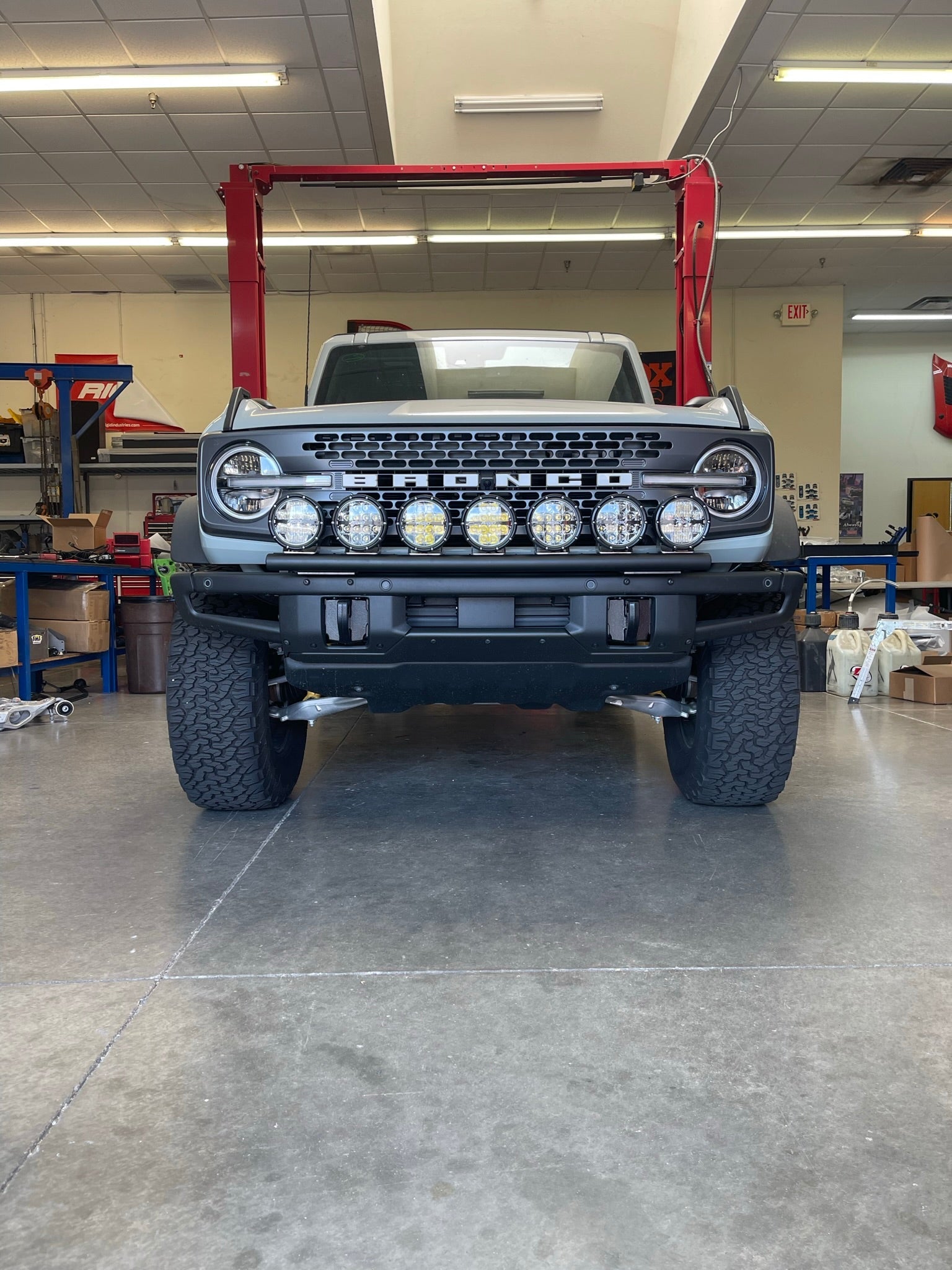 Front view of a 6th Gen Bronco equipped with a front light mount kit for the modular stock bumper, showcasing multiple lights.