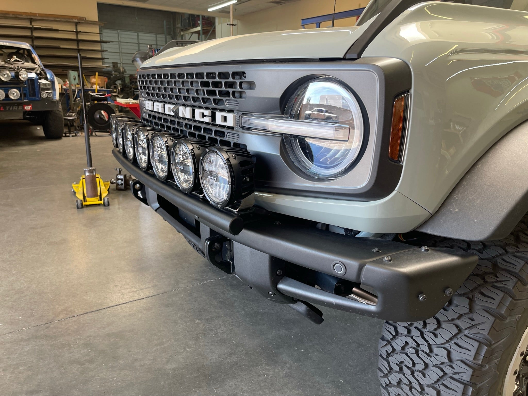 6th Gen Bronco Front Light Mount Kit installed on a modular stock front bumper, showcasing multiple lights for enhanced visibility.