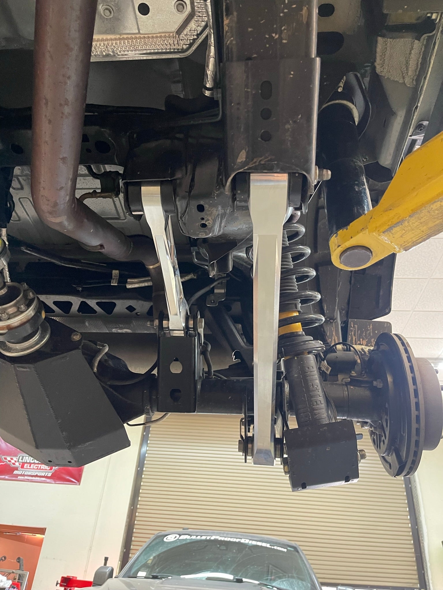 Billet aluminum rear suspension arms installed on a Bronco, showcasing enhanced durability and performance.