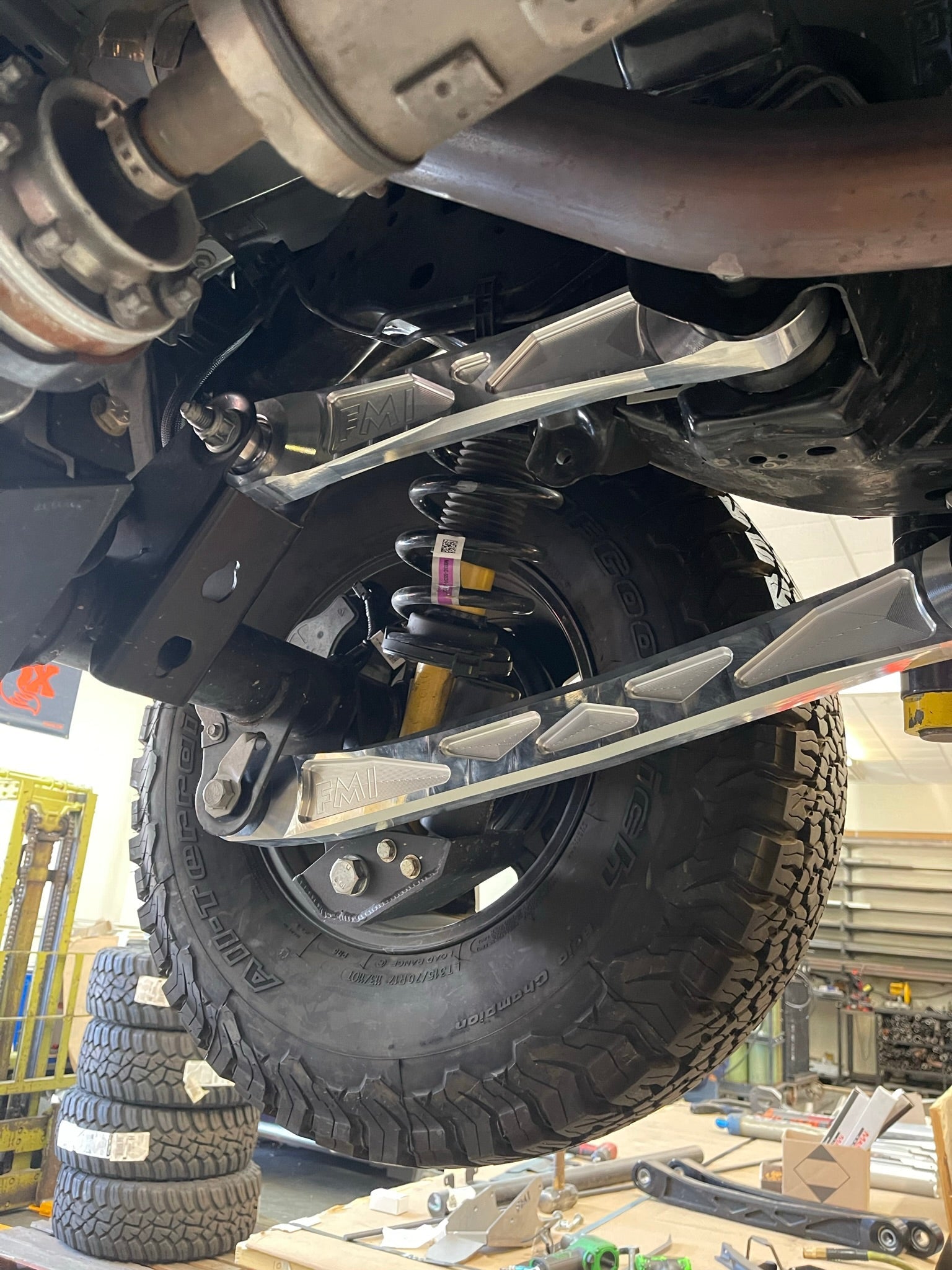 Bronco rear suspension kit featuring billet aluminum rear arms, showcasing durable construction and offroad readiness.