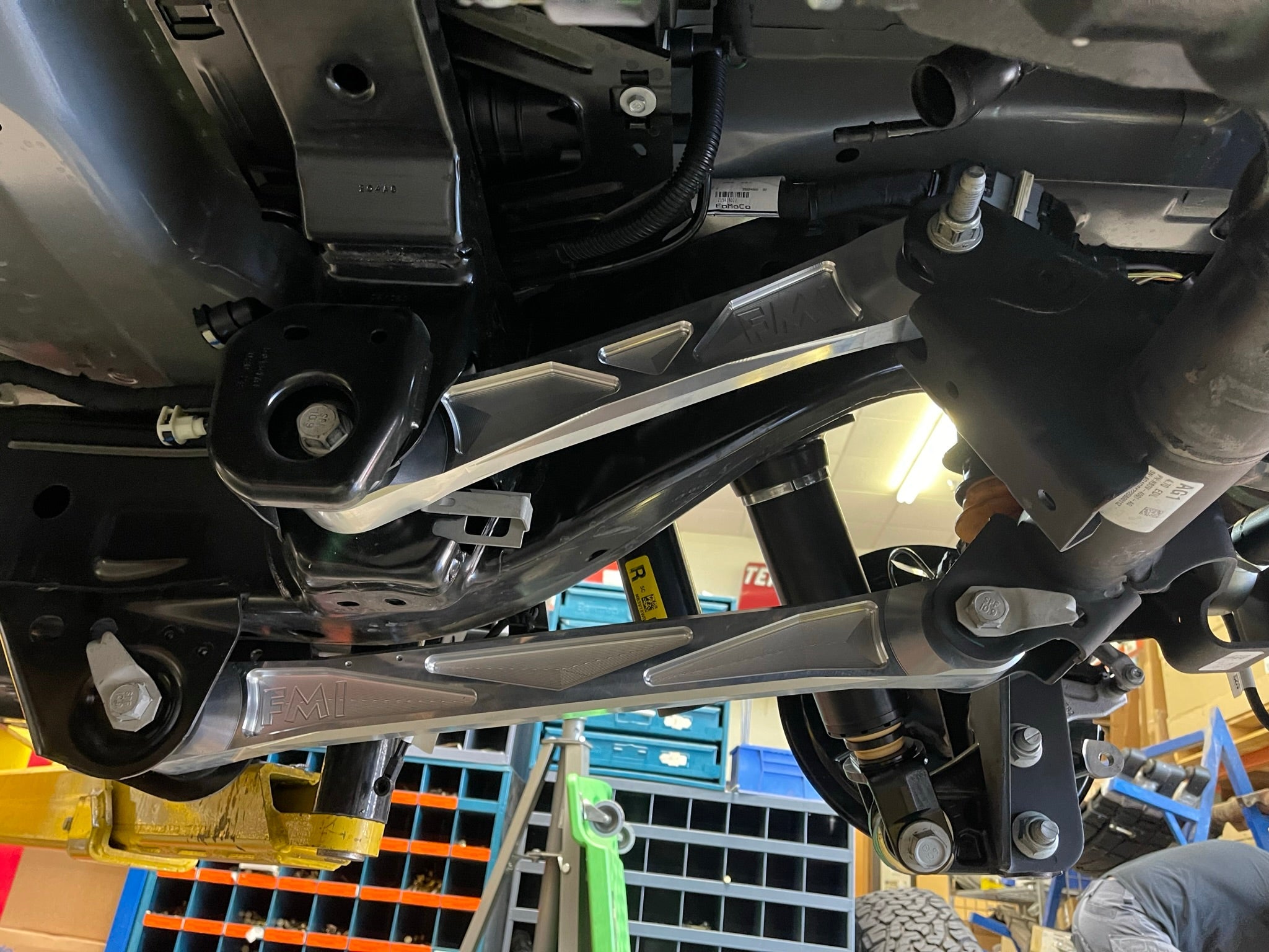 Bronco Raptor billet aluminum rear suspension upper arms installed, showcasing durability and performance enhancement for offroad vehicles.