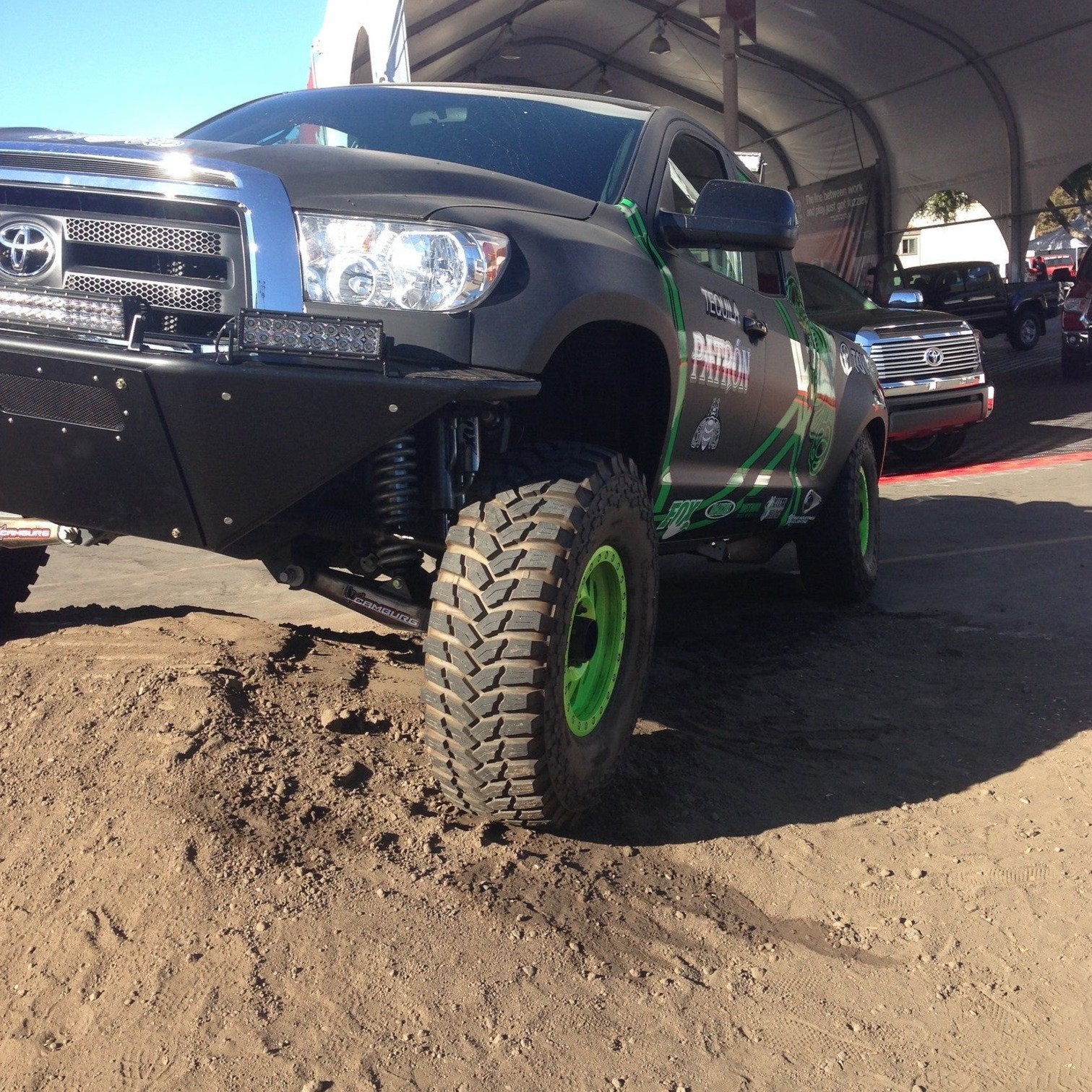2007-2013 Toyota Tundra fenders showcased on a modified truck with offroad tires and a rugged design.