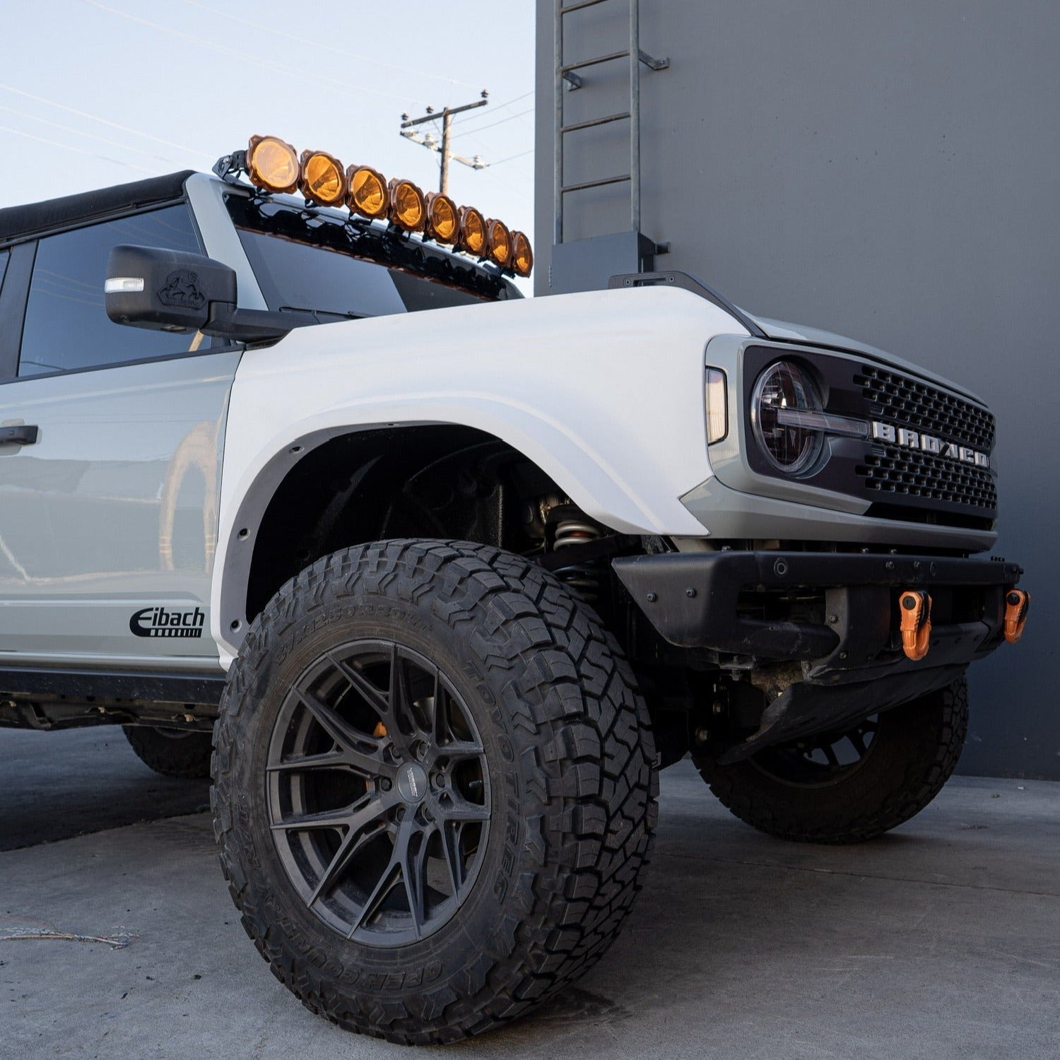 2021-2025 Ford Bronco fenders on a modified vehicle with offroad tires and a roof-mounted light bar.