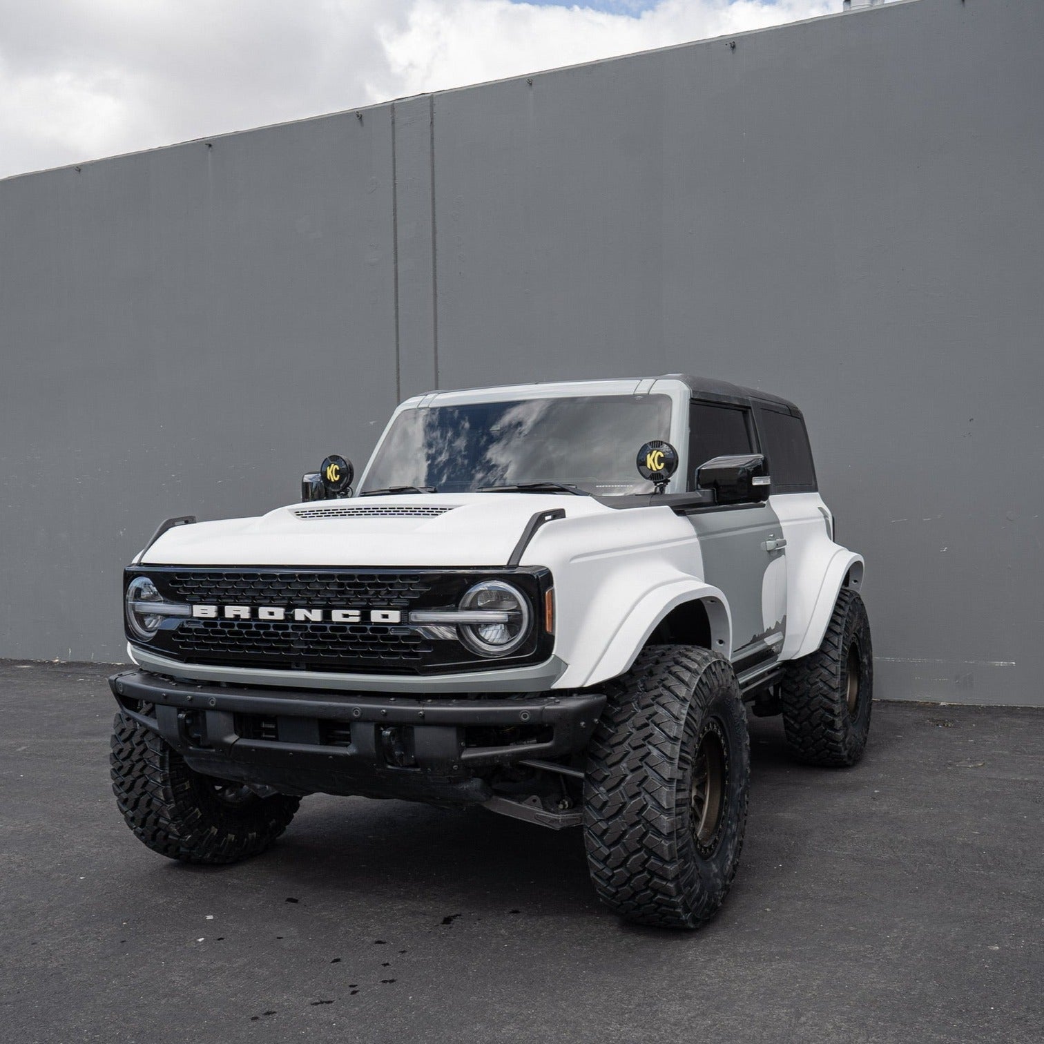 2021-2025 Ford Bronco 2-Door Rear Quarter Kit displayed on a modified white Bronco with offroad tires.