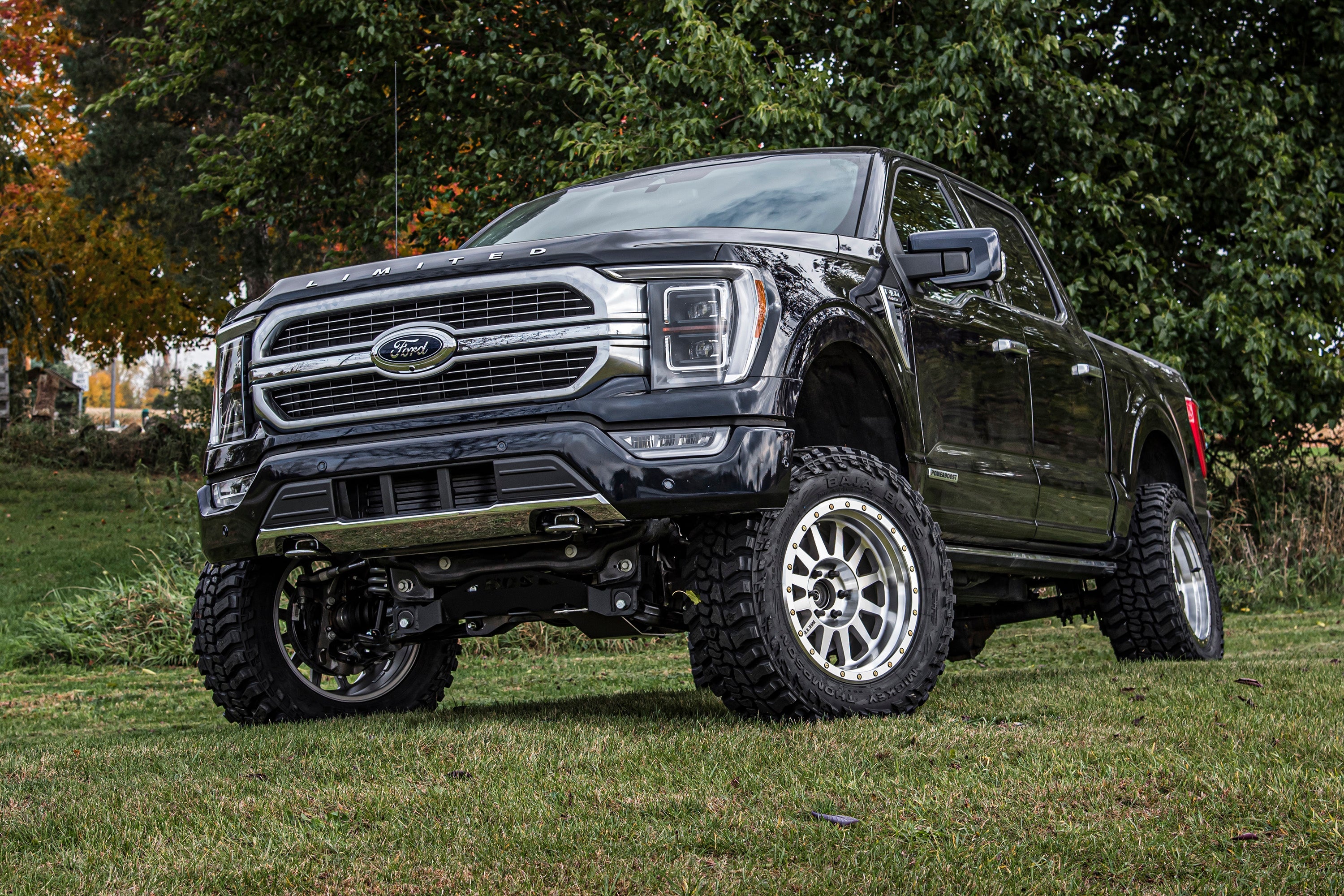 6-inch lift kit with FOX 2.5 Performance Elite coil-over installed on a black Ford F150 4WD, showcasing enhanced off-road capability.