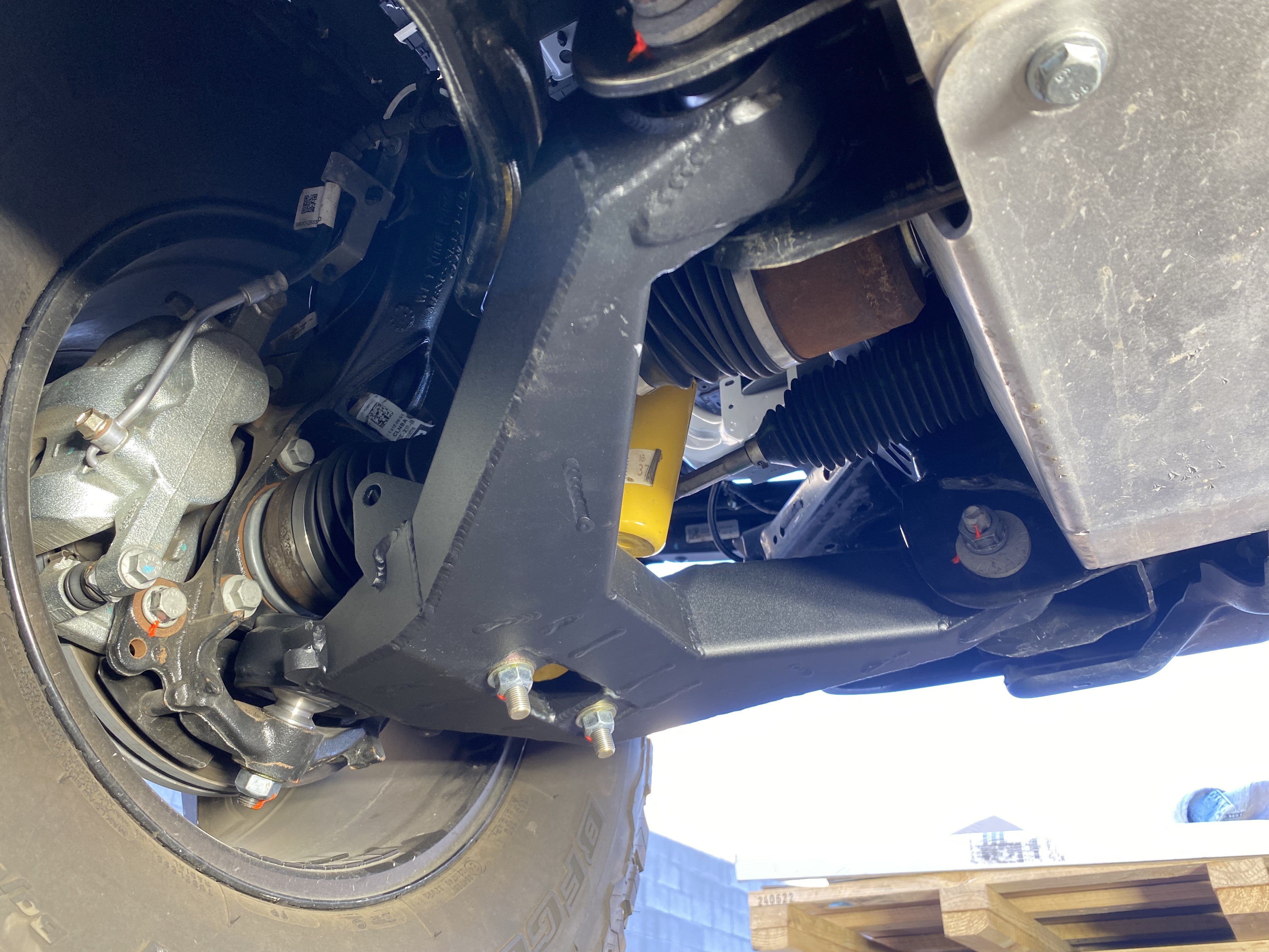 2021 and up Bronco fabricated lower arm kit with bypass shock mount, showcasing stock length suspension components.
