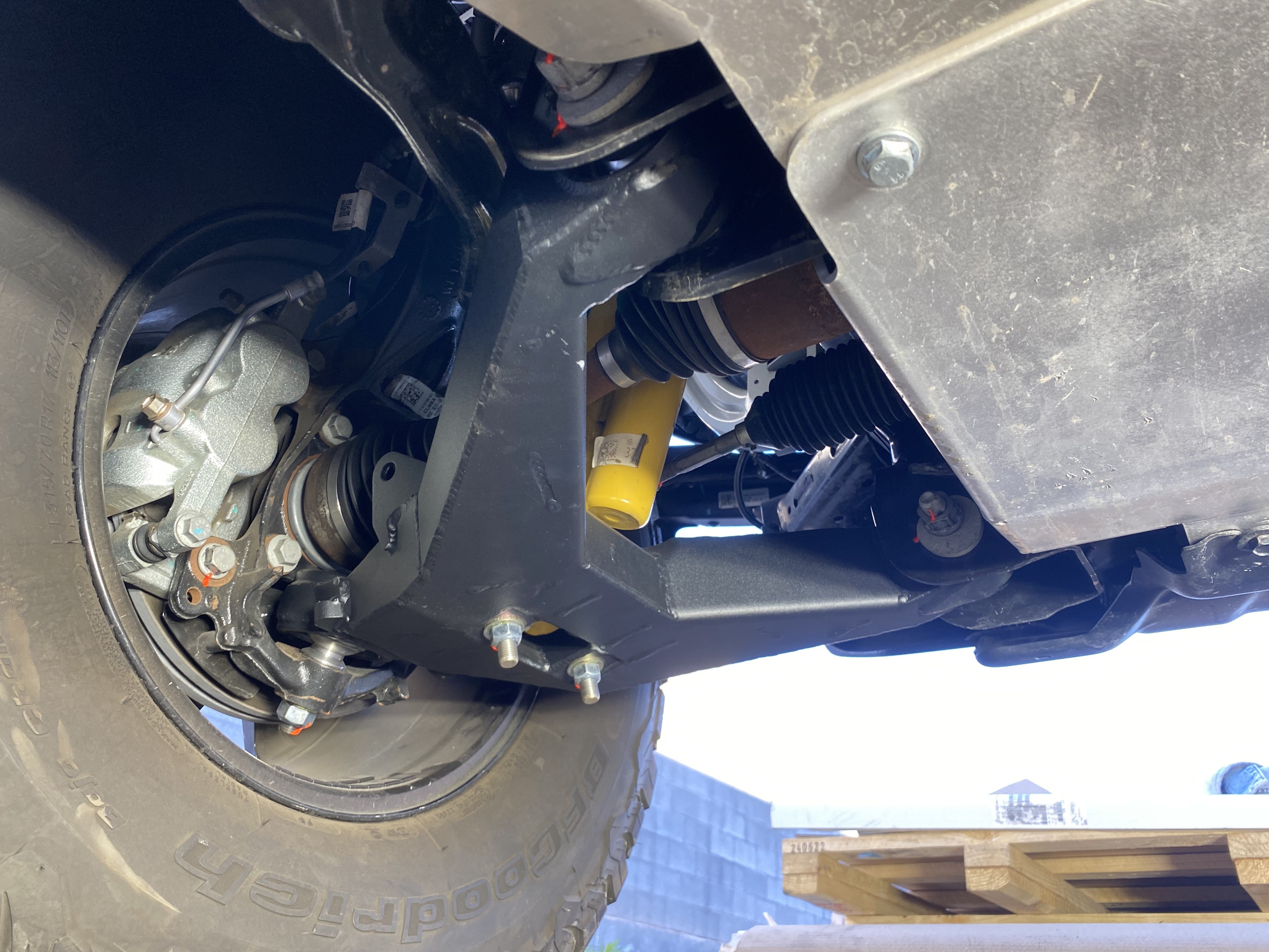 2021 and up Bronco fabricated lower arm kit with bypass shock mount, showcasing stock length suspension components.