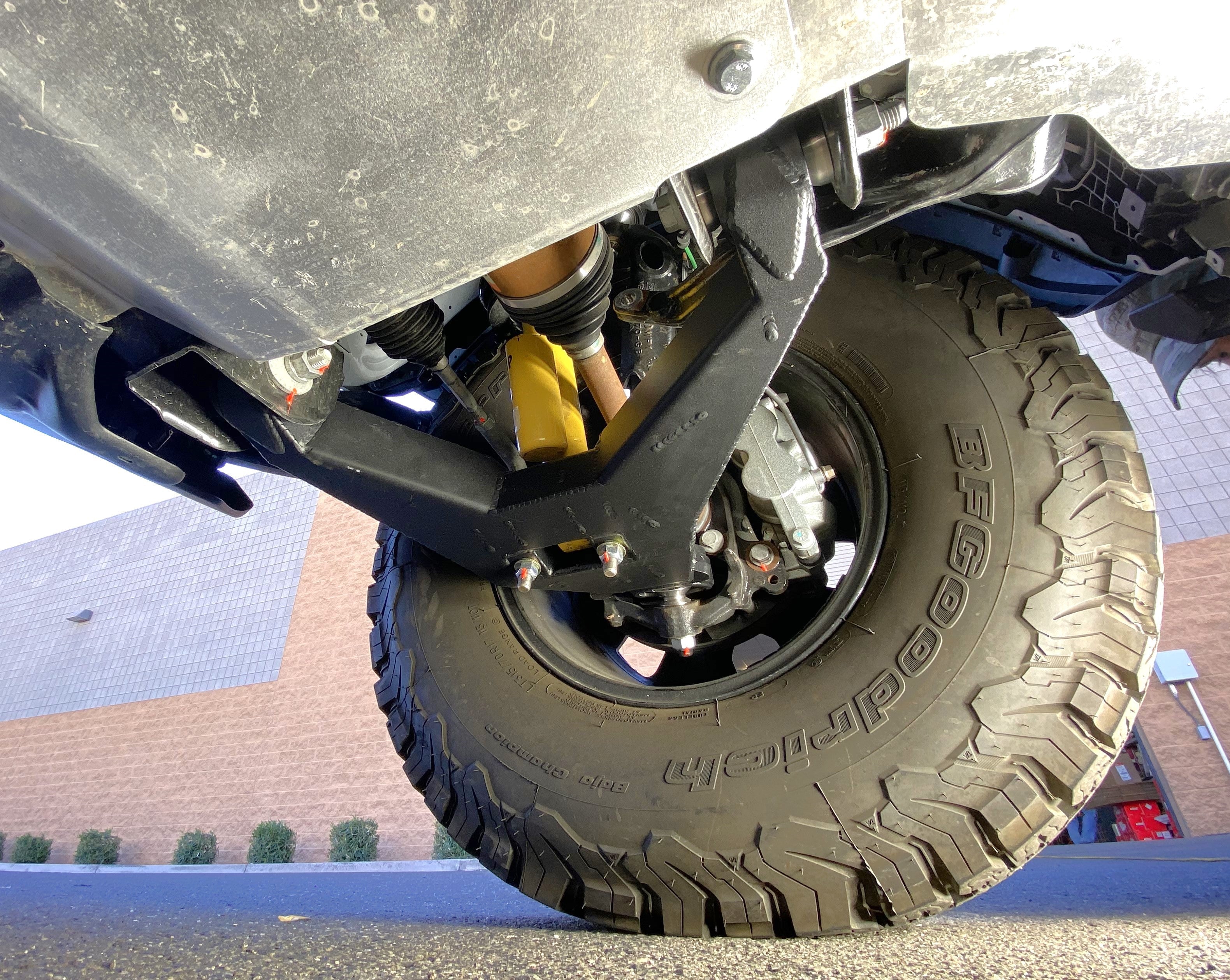 2021 and up Bronco fabricated lower arm kit with bypass shock mount, showcasing stock length and rugged offroad design.