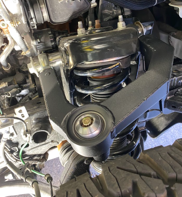 2021 and up Bronco fabricated upper arm kit in stock length, showcasing suspension components and durable construction.