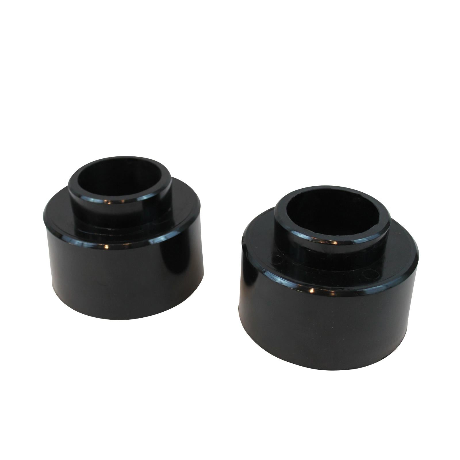 Black 2-inch rear spring spacer lift kit for various GM models, enhancing off-road performance and vehicle height.