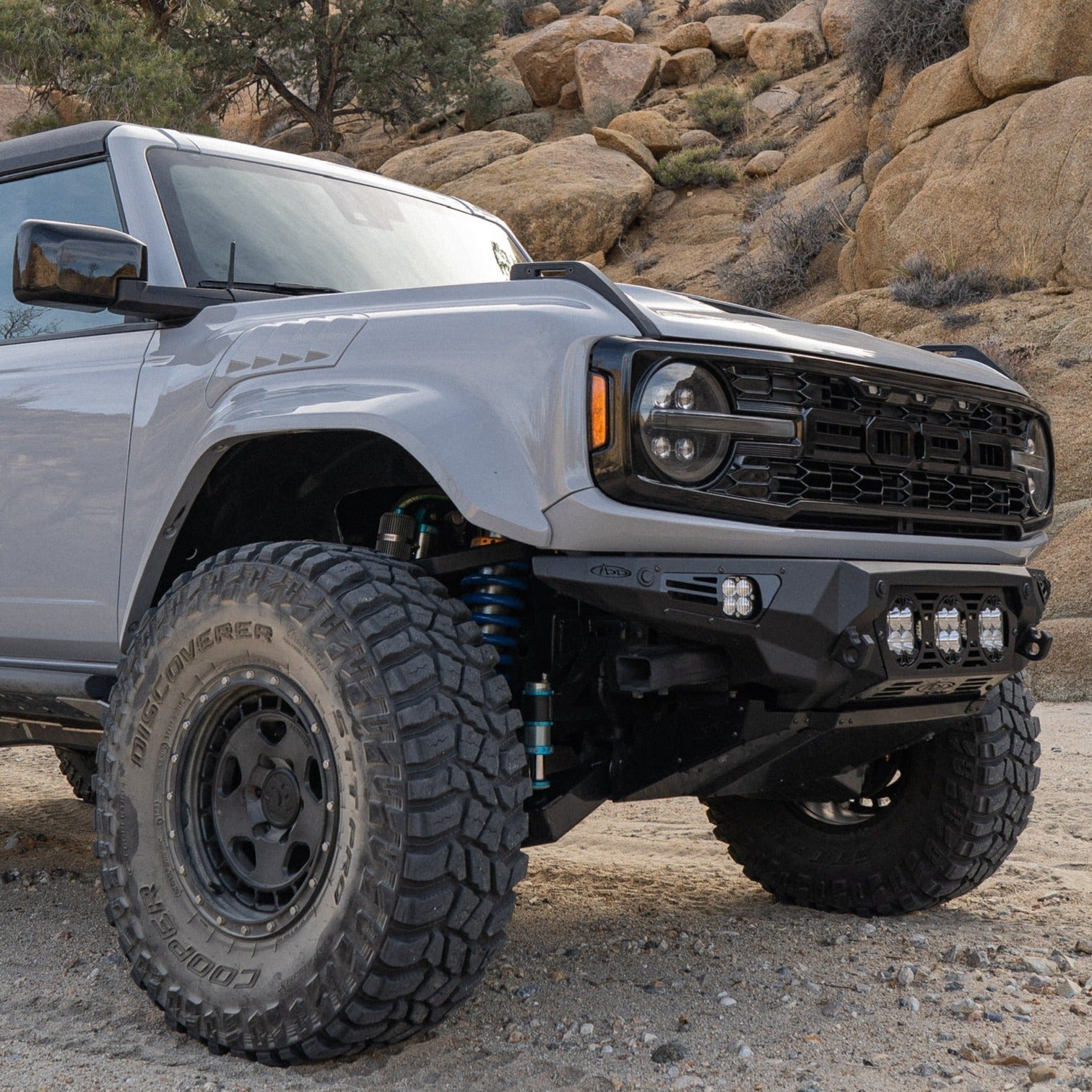 2022-2025 Ford Bronco Raptor fenders showcasing rugged design and enhanced off-road capability in a desert setting.
