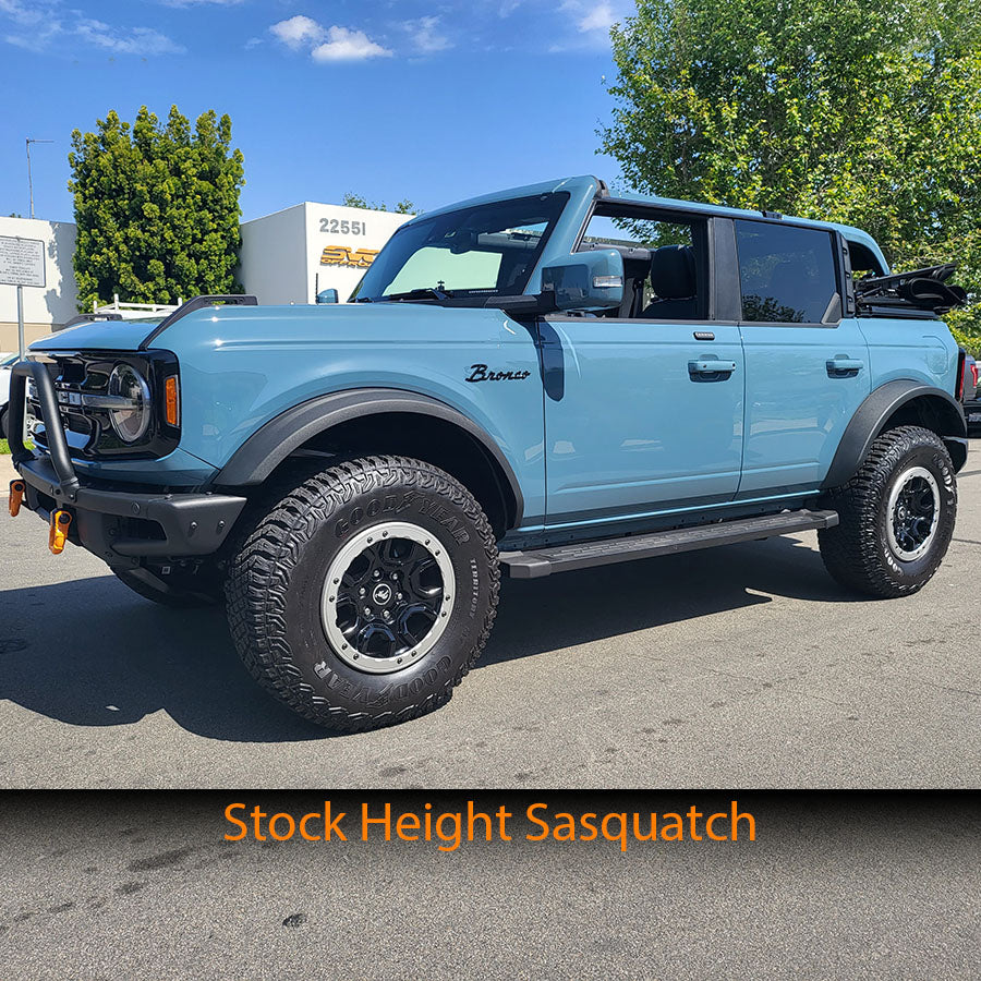 2021 Ford Bronco with coil spacers, showcasing enhanced suspension and off-road capability in a vibrant blue color.