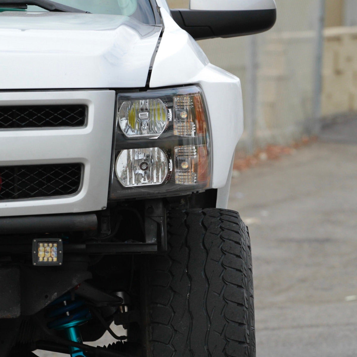 2007-2013 Chevrolet Silverado fenders showcasing a close-up view of the front end and tire. Ideal for offroad upgrades.