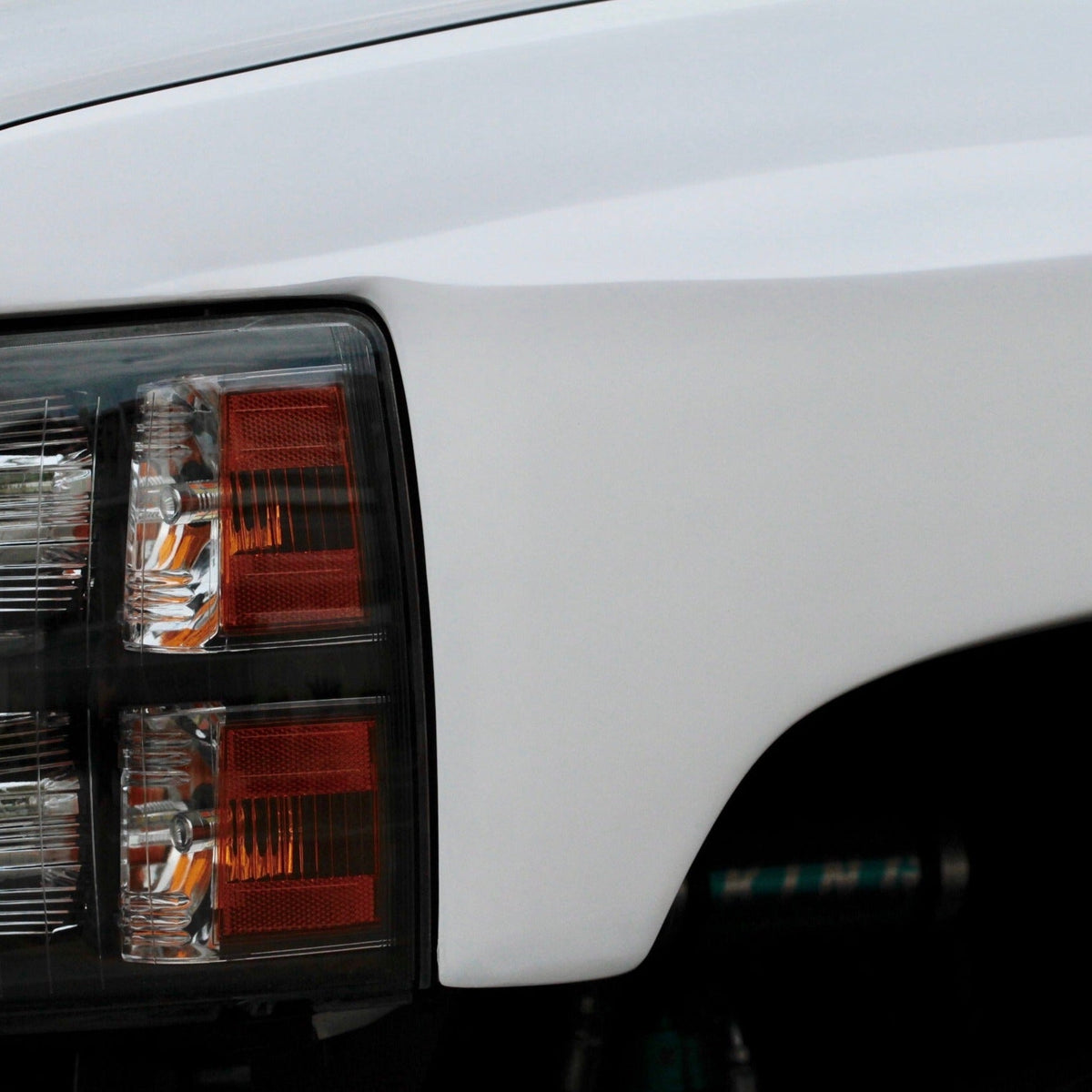 2007-2013 Chevrolet Silverado fender showcasing a sleek design and integrated headlight for enhanced vehicle aesthetics.