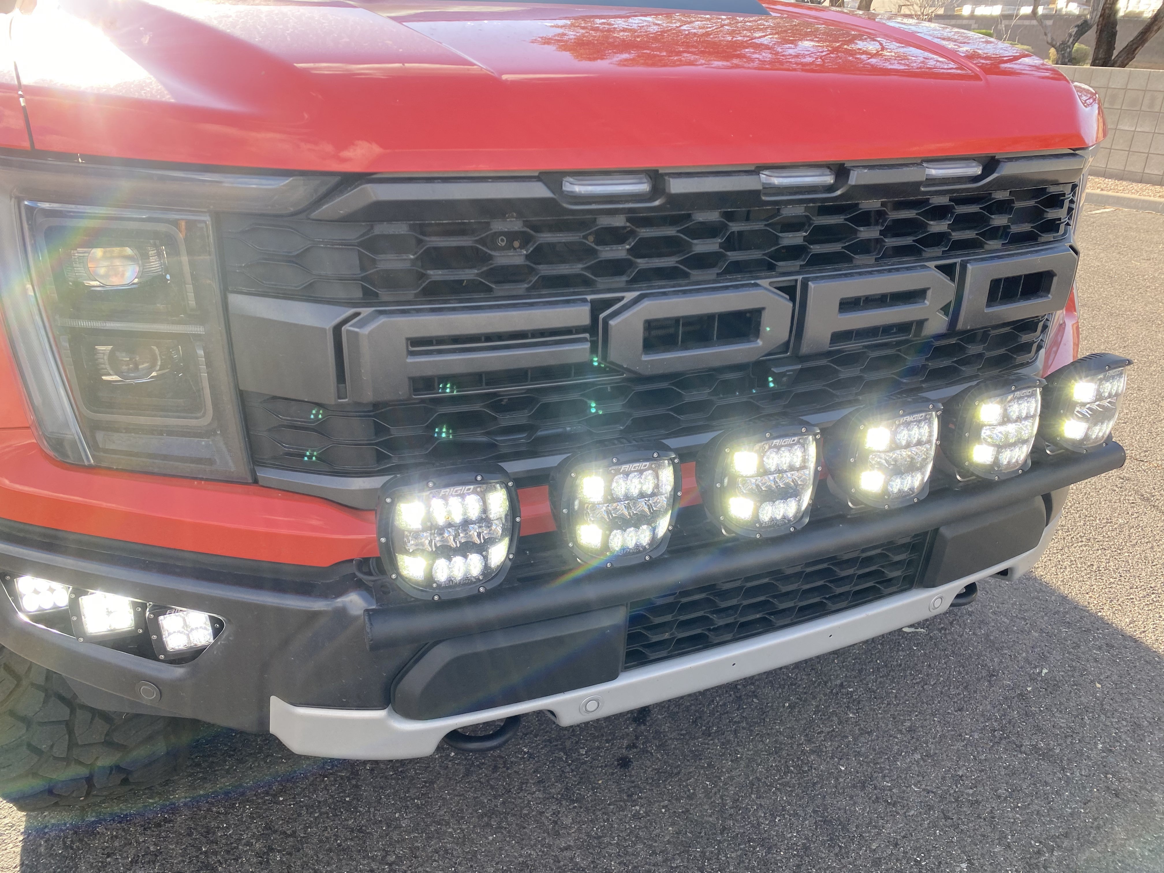 2024 Raptor Front Light Mount Kit for modular bumper, showcasing multiple mounted lights for enhanced visibility.