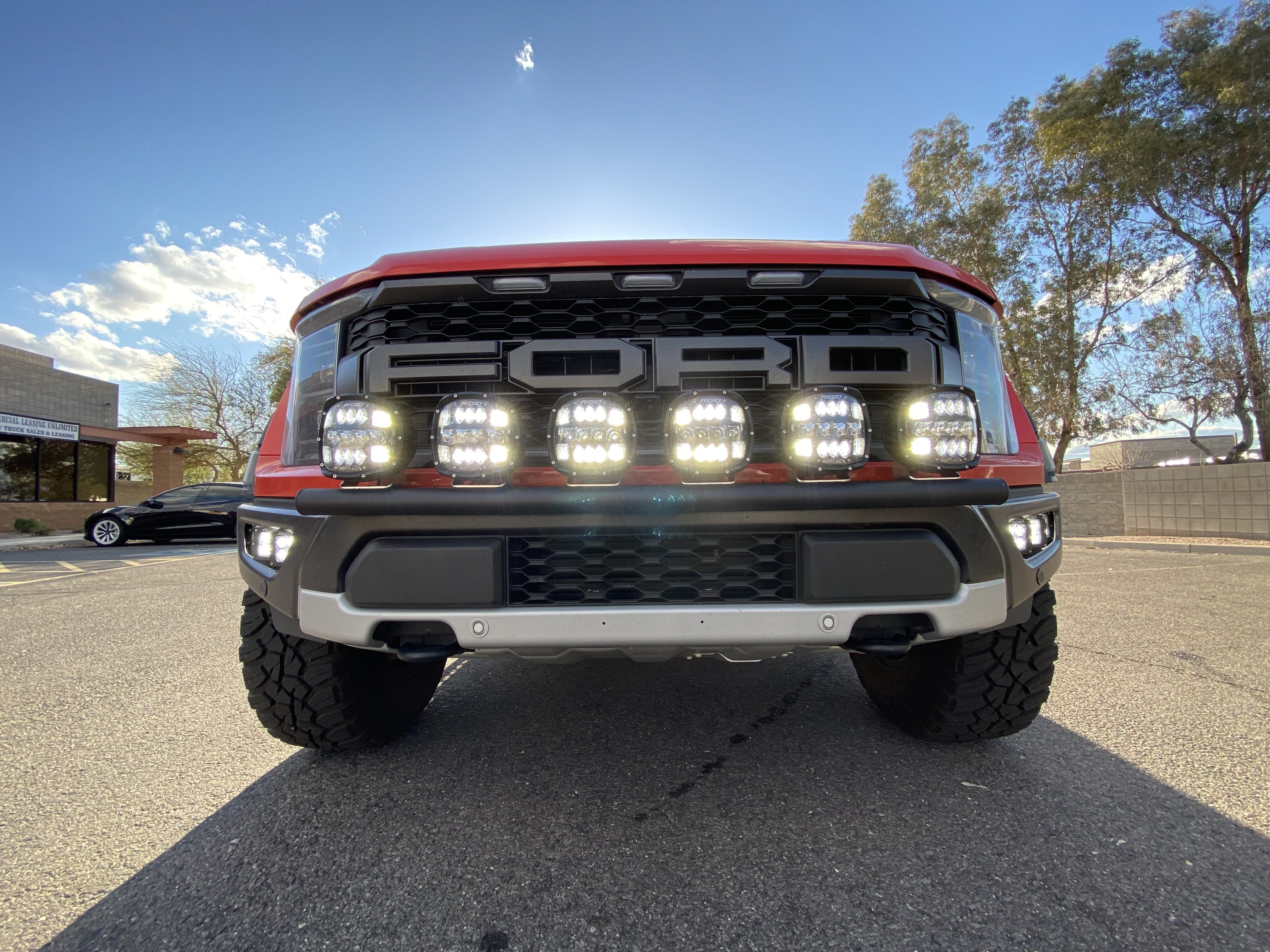 2024 Raptor Front Light Mount Kit for modular bumpers, showcasing multiple light options on a rugged truck front.
