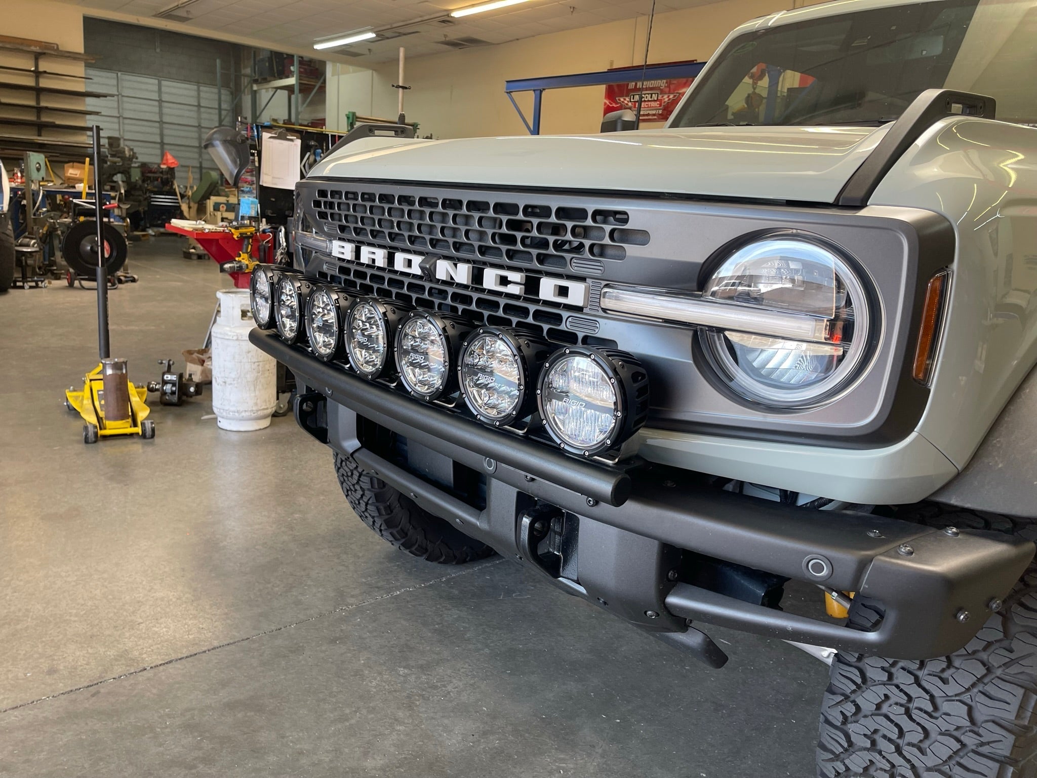 2022-UP Bronco Raptor Front Light Mount Kit showcasing multiple lights mounted on the front grille for enhanced visibility.