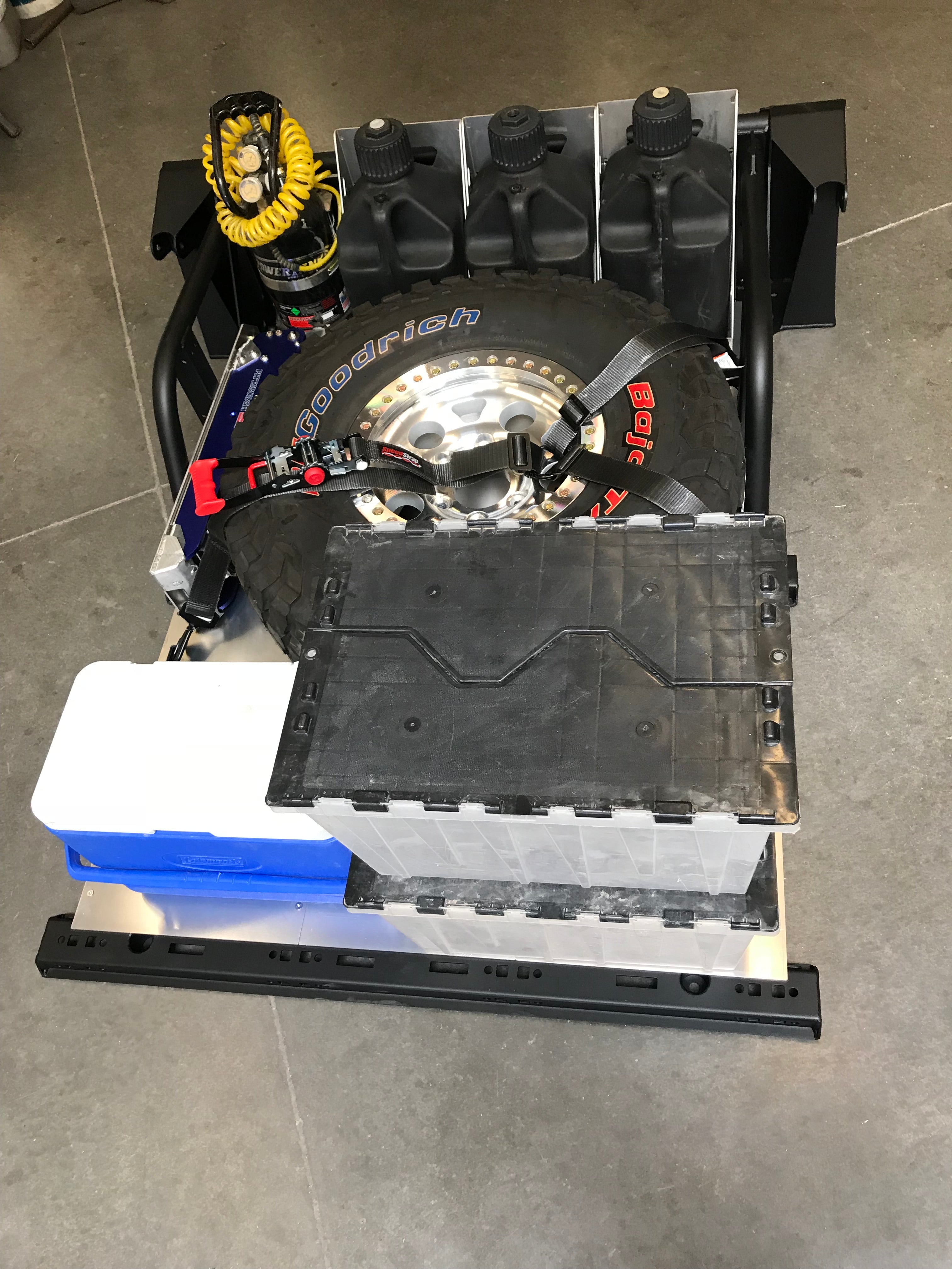 Modular bed organizer for 2017-2024 Ford Raptor and F150, featuring storage for tools, tires, and equipment.