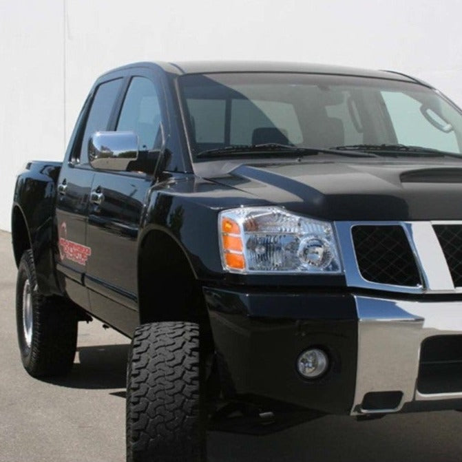 2004-2014 Nissan Titan fenders displayed on a black truck, showcasing a rugged and stylish offroad appearance.