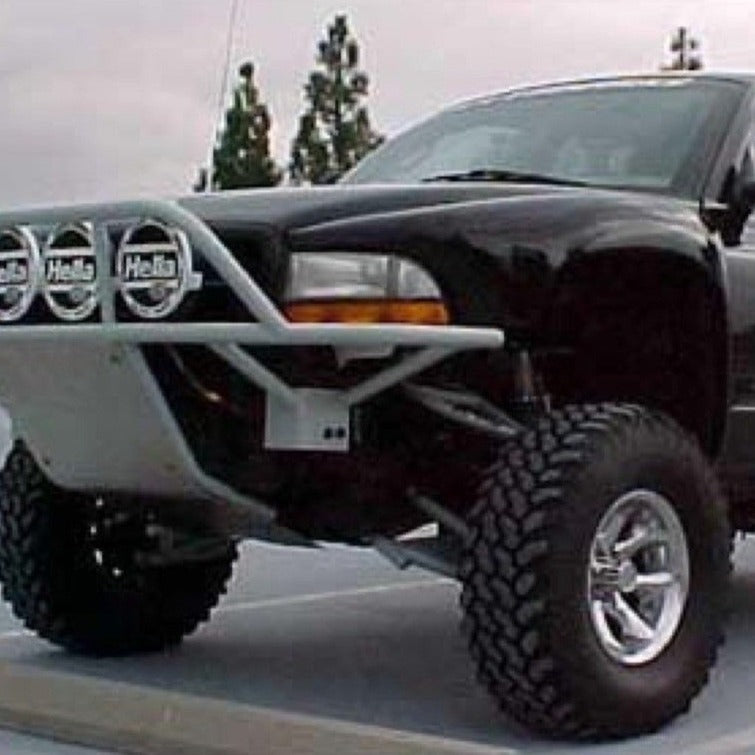 1997-2004 Dodge Dakota fenders showcasing a rugged offroad truck with upgraded suspension and aggressive tires.