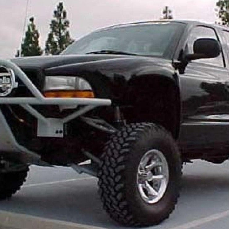 Black 1998-2003 Dodge Durango with offroad fenders, showcasing a rugged design and elevated stance for enhanced performance.