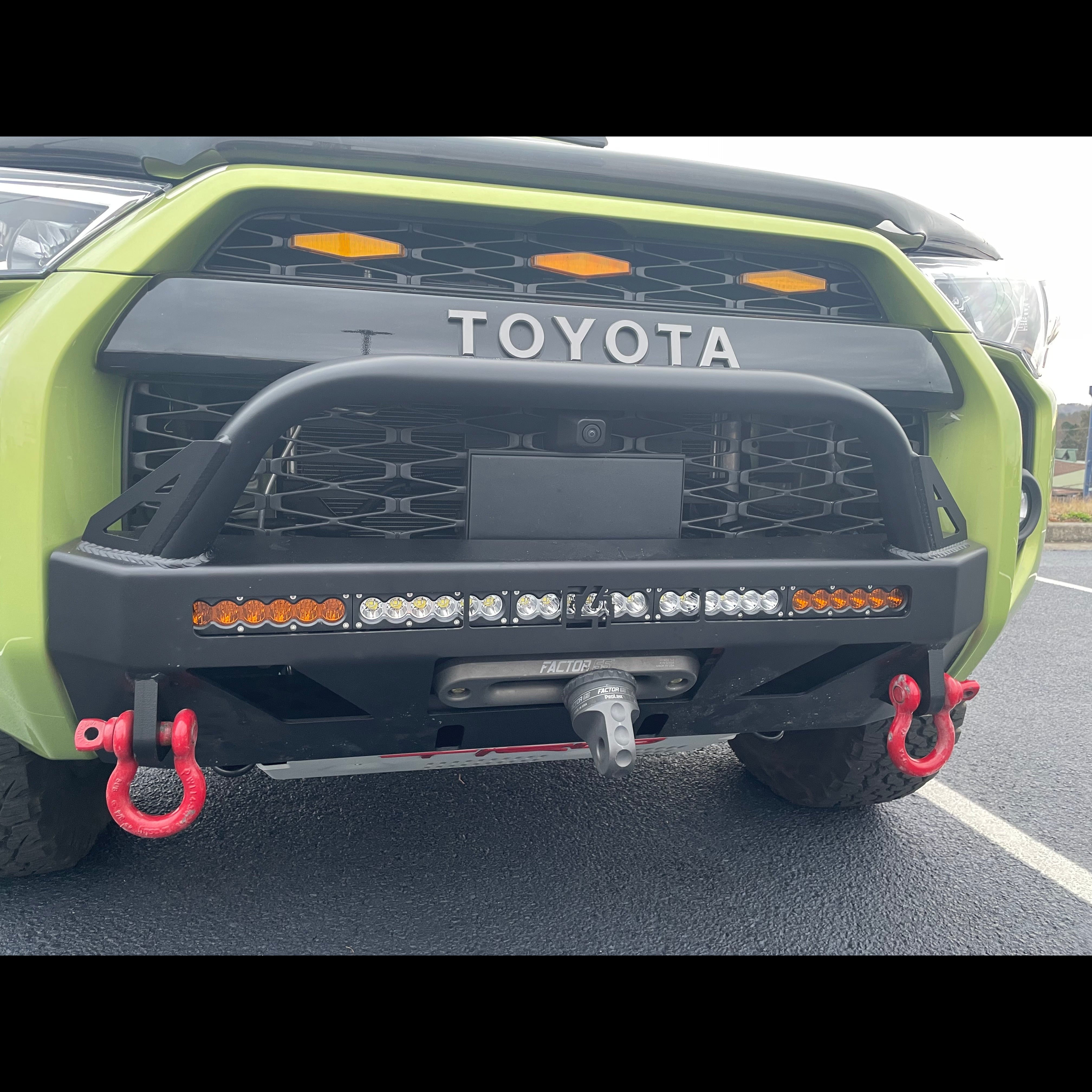4Runner Lo-Pro winch bumper for 2014-2024 models, featuring integrated lights and recovery hooks, enhancing off-road capability.