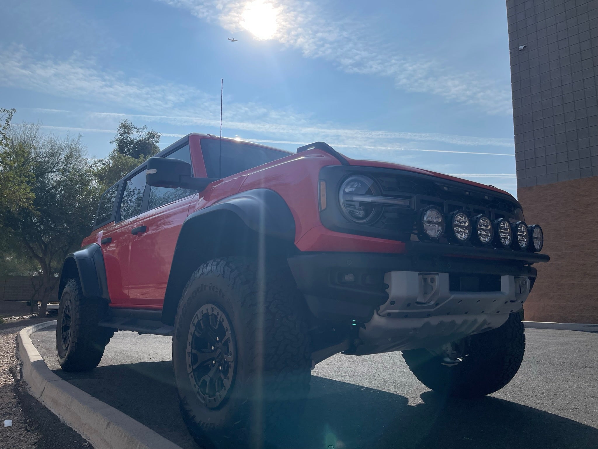 6th Gen Bronco Front Light Mount Kit for Modular Stock Bumper, showcasing versatile light mounting options on a red Bronco.