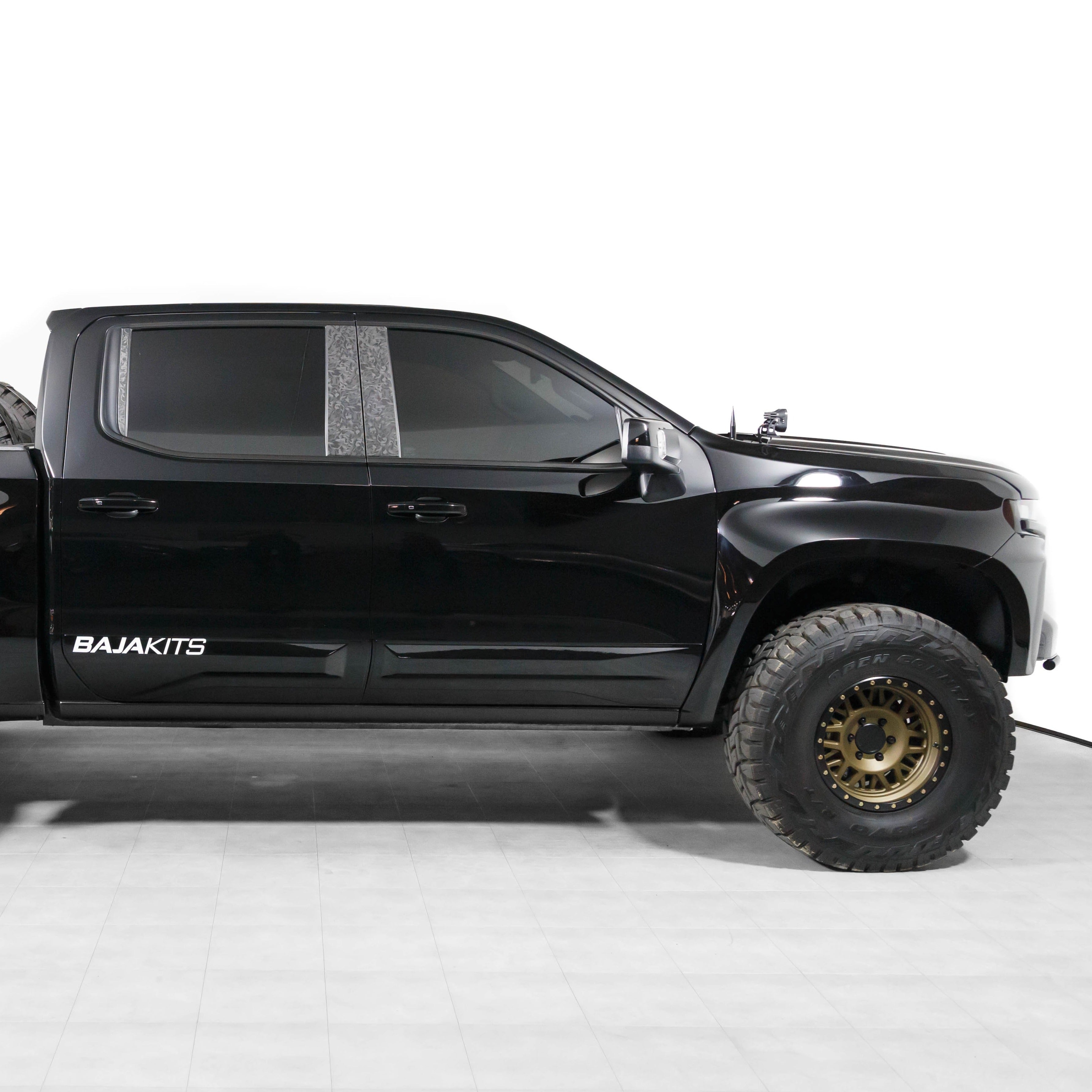 2019-2025 Chevrolet Silverado fenders showcasing a sleek black truck with offroad tires and a rugged design.