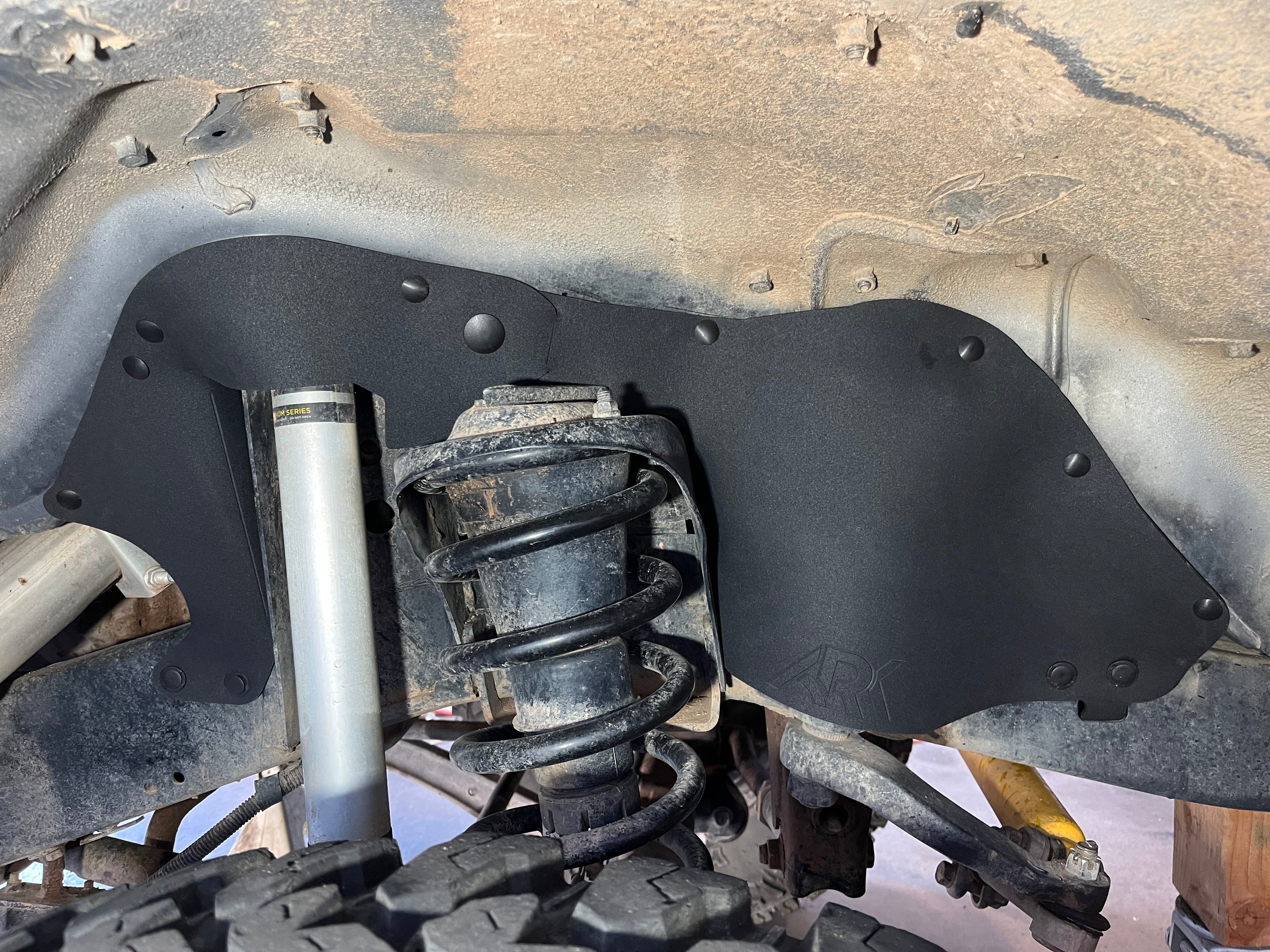 Splash guards for 1990-1998 Toyota Land Cruiser HDJ80, designed to protect undercarriage components from debris.