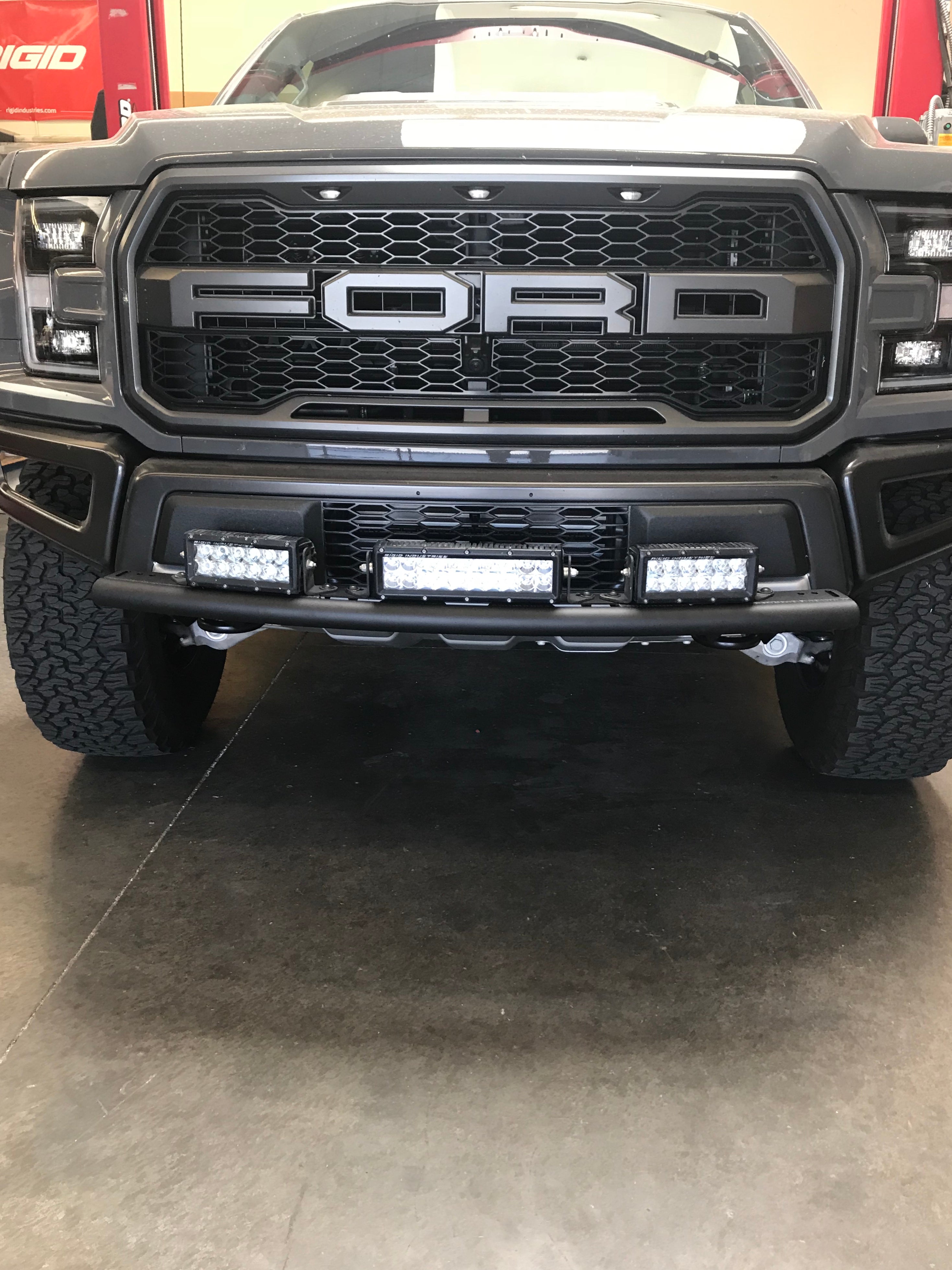 Single tube light mount installed on a 2017+ Raptor stock bumper, showcasing LED lights for enhanced visibility.