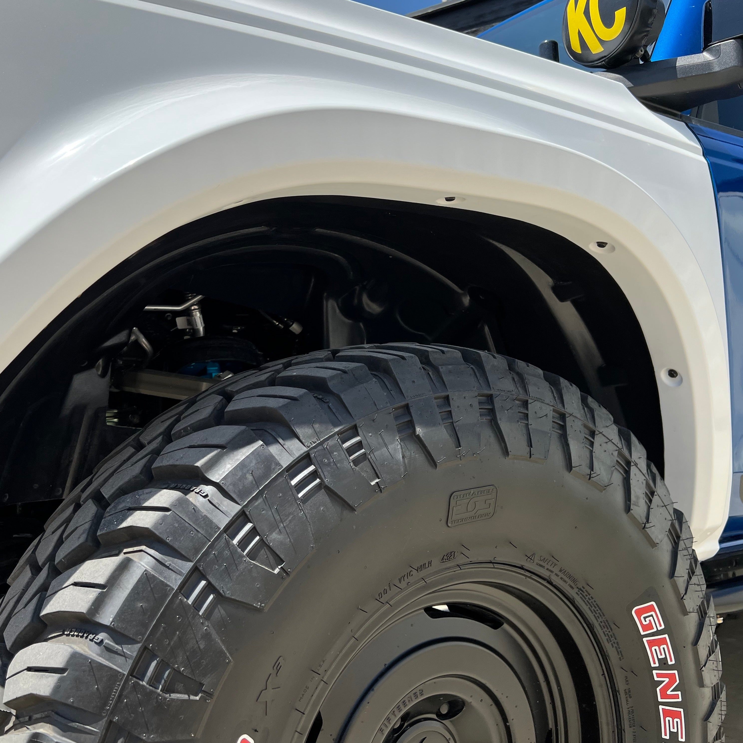 2021-2025 Ford Bronco fender showcasing a rugged design and large off-road tire for enhanced performance and style.