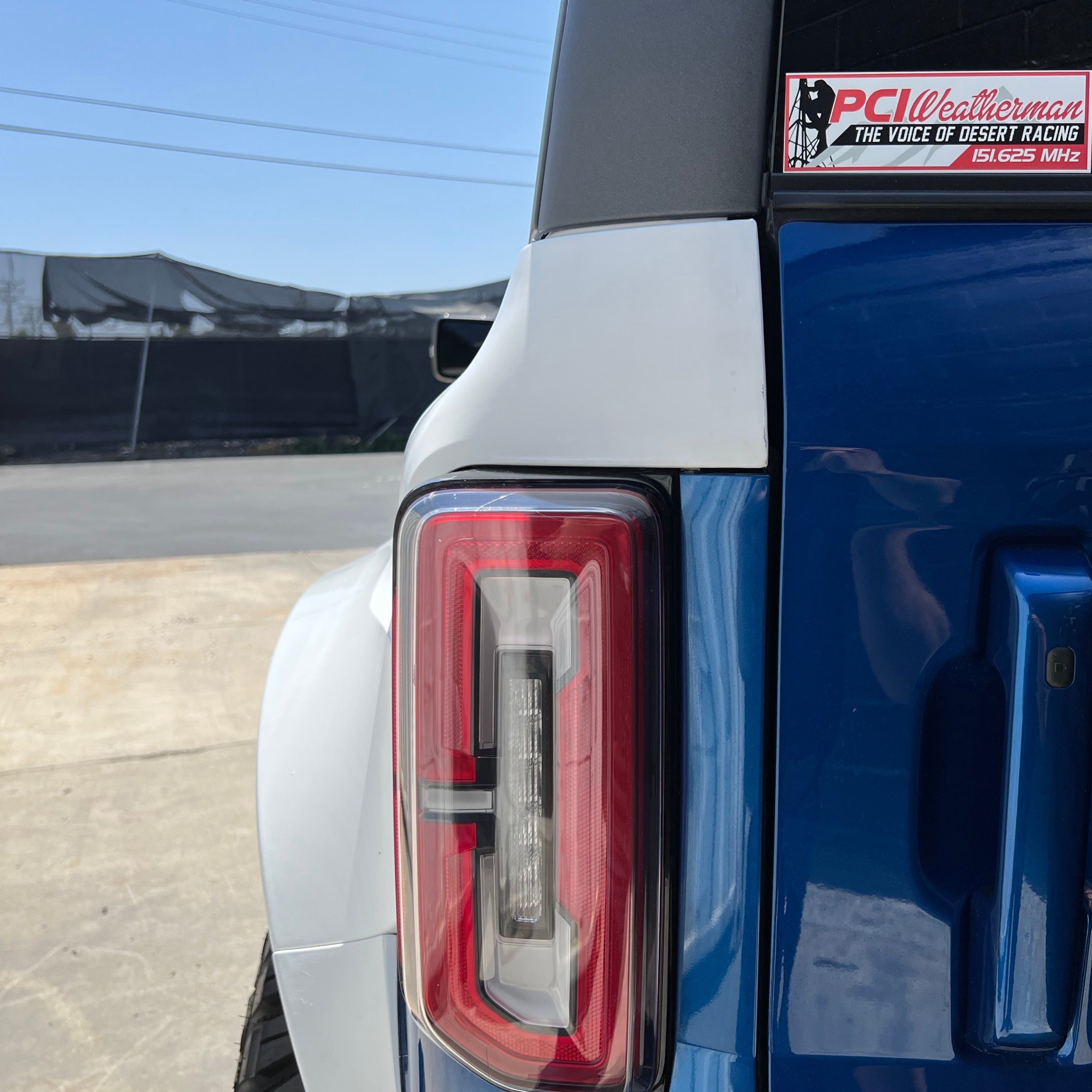 2021-2025 Ford Bronco 4-Door Rear Quarter Kit showcasing the rear light and body design in blue and white.