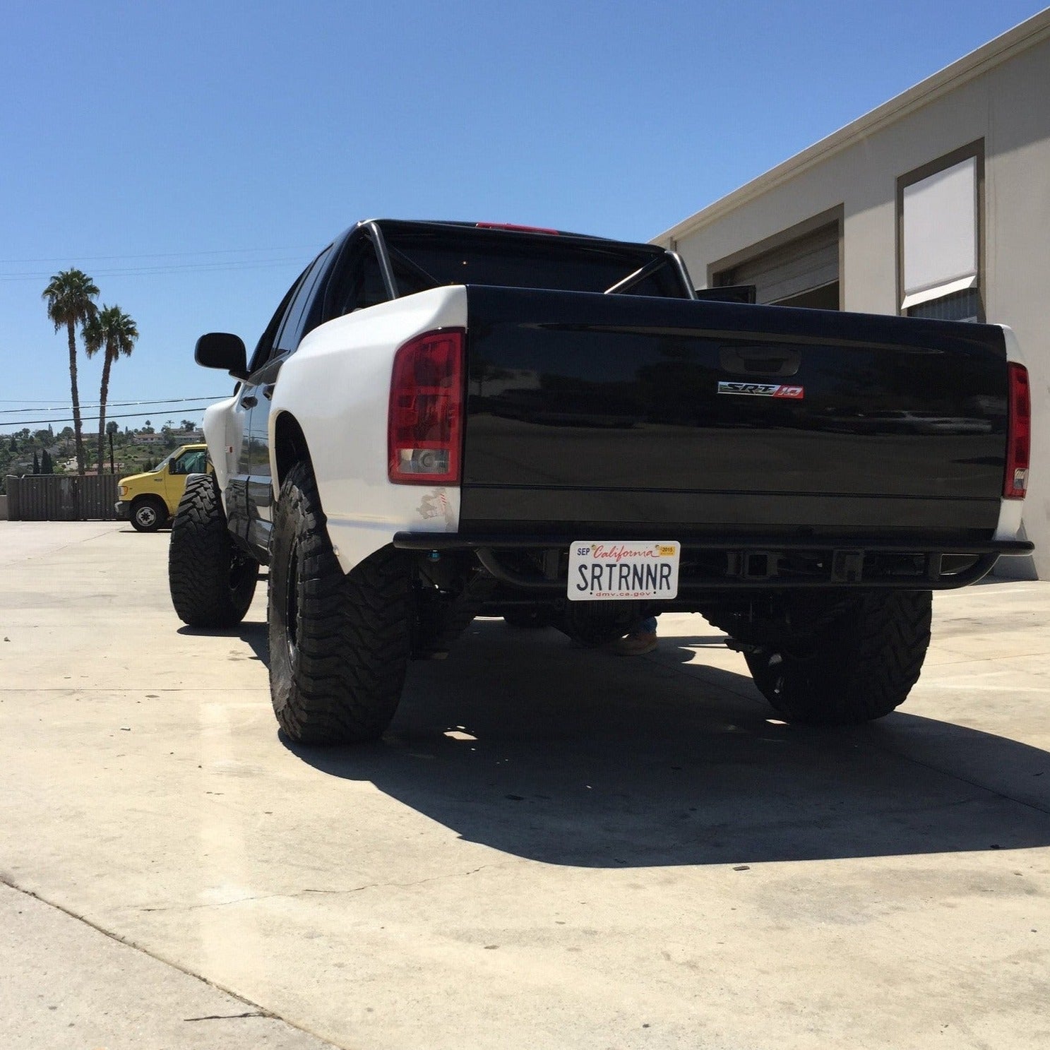 2003-2008 Dodge Ram bedsides showcased on a modified truck with a sleek black and white design.