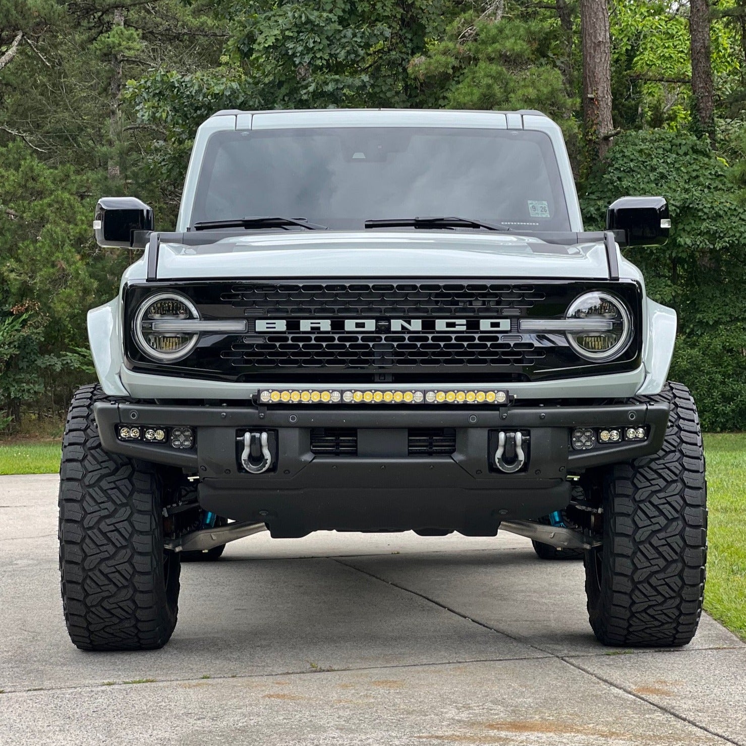 2021-2025 Ford Bronco with aftermarket fenders and off-road lights, showcasing a rugged, elevated stance.