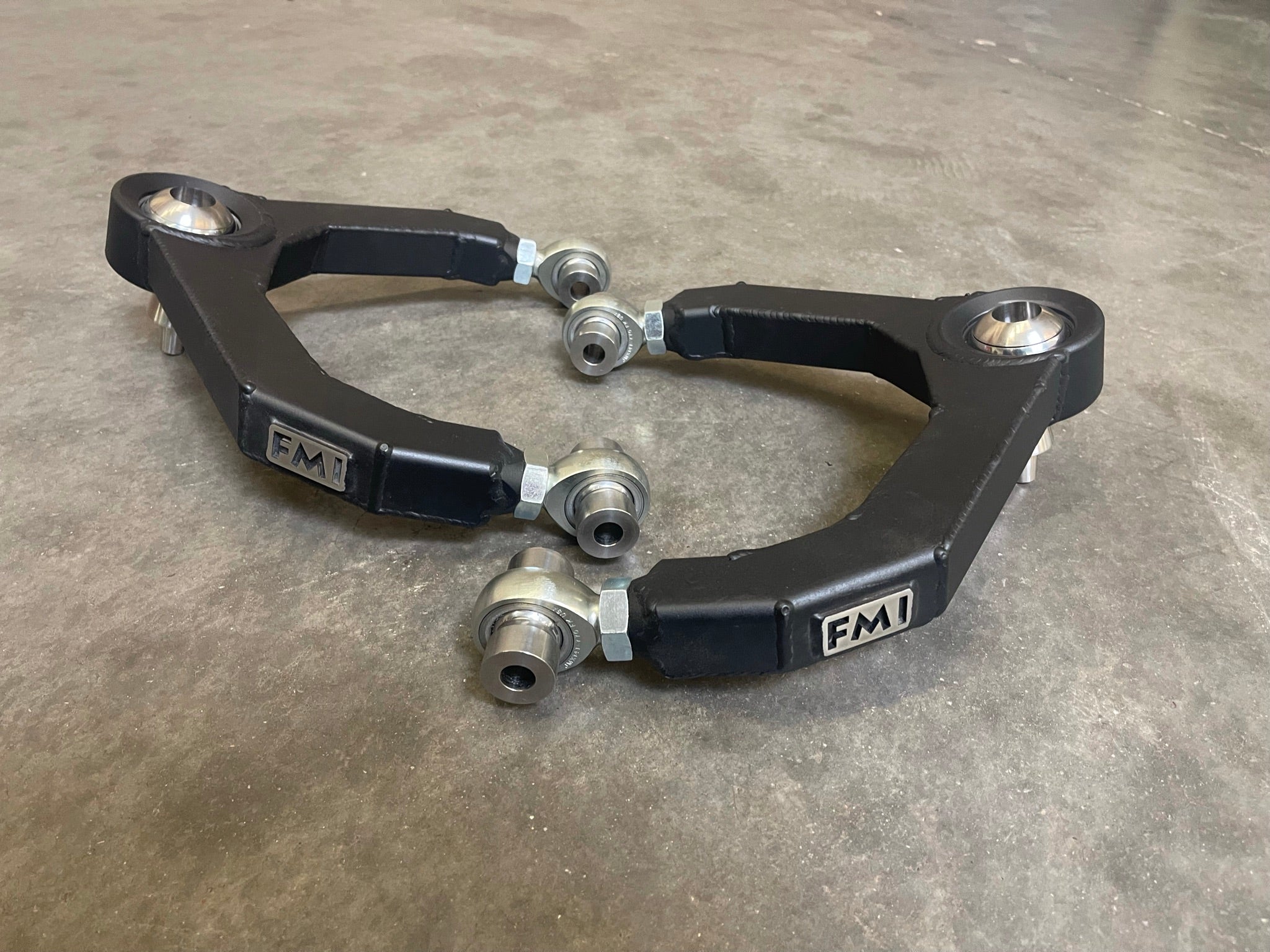 Fabricated upper arm kit for 2010-2014 Raptor, designed for enhanced performance and durability in offroad conditions.