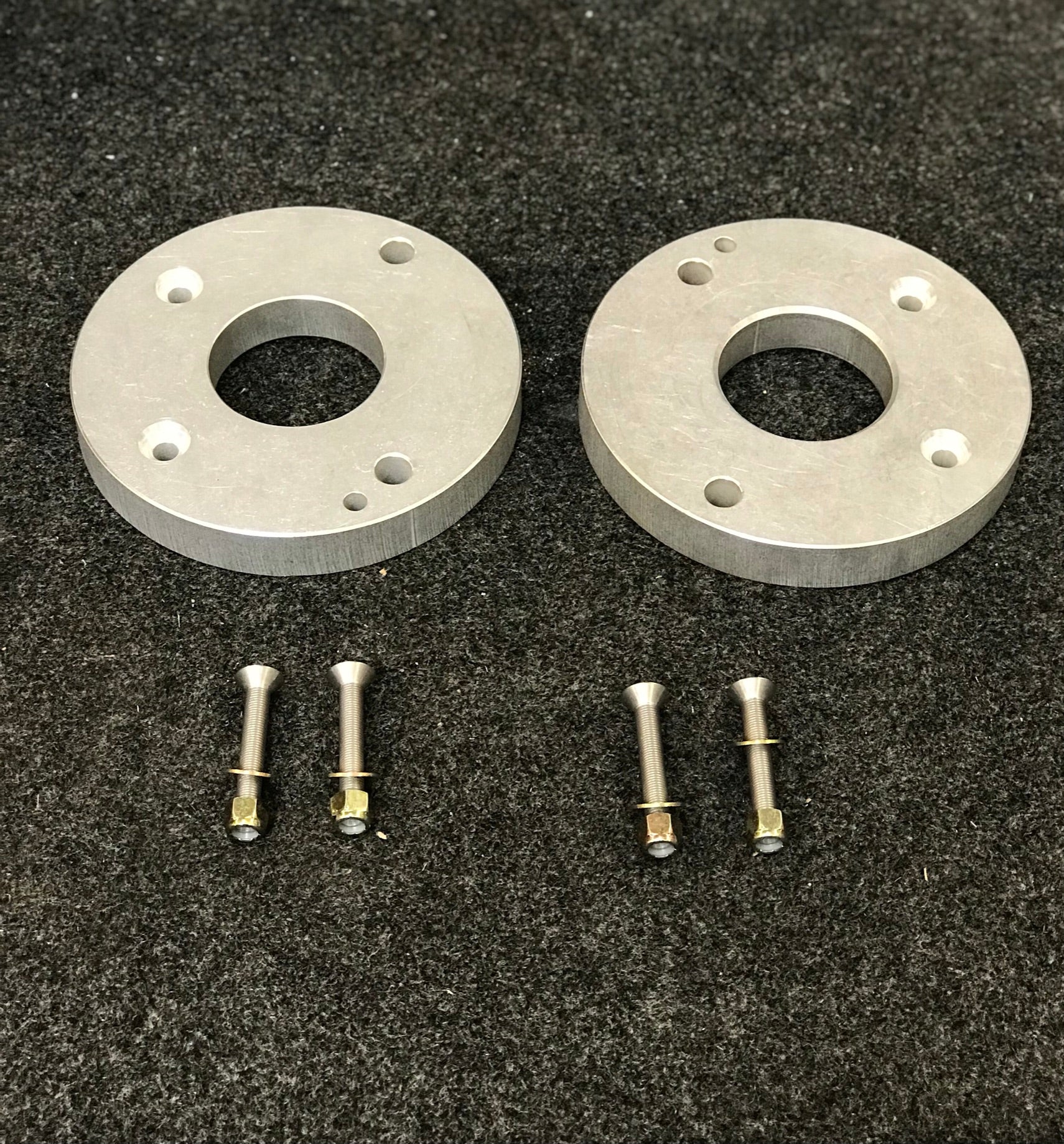 2021 and up Ram TRX rear spring spacer lift kit by Foutz Motorsports with aluminum spacers and installation hardware.