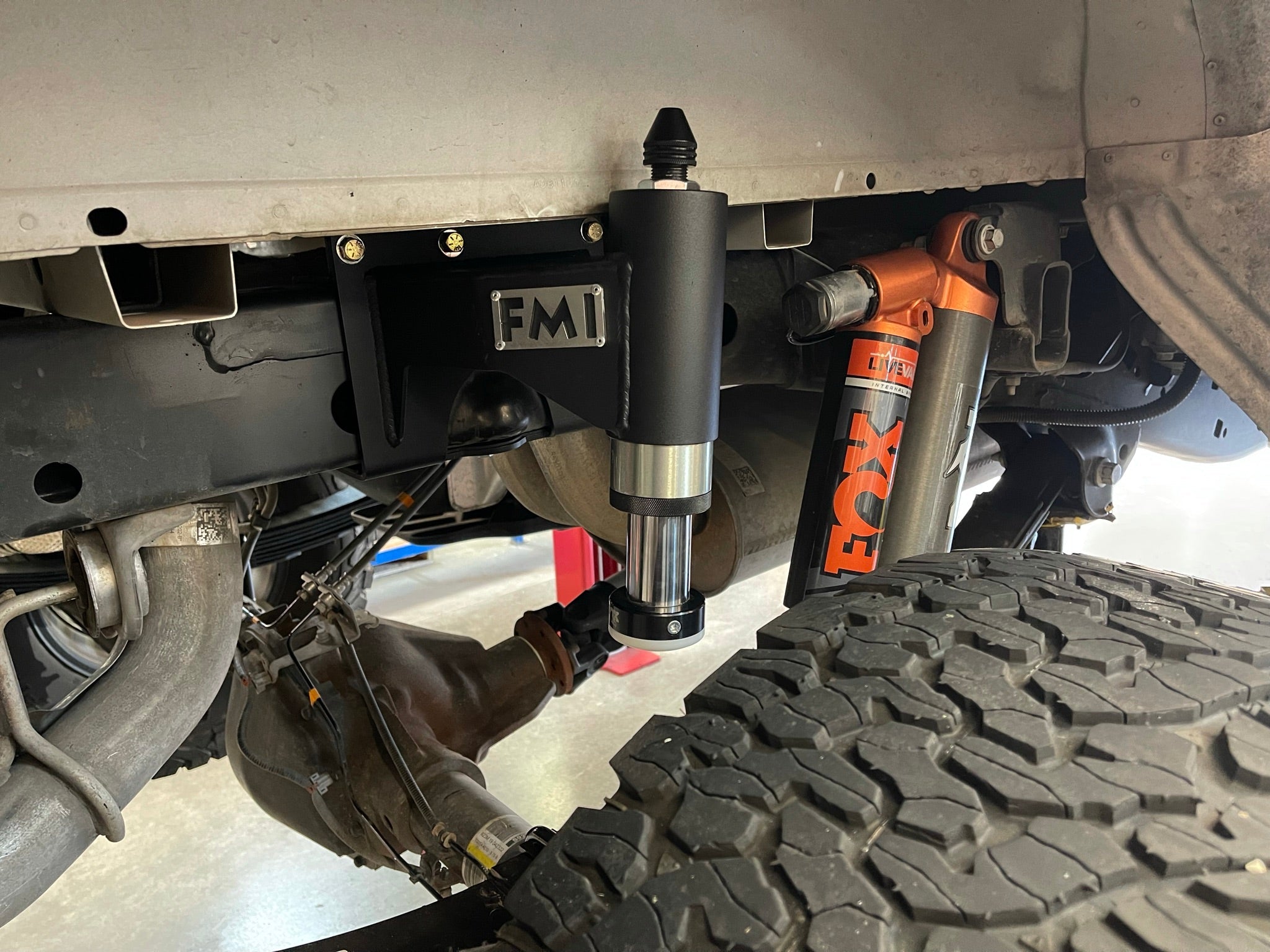 Rear bump stop kit for 2017-2020 Raptor and 2015-2024 F150, showcasing installation with FOX shocks and durable components.