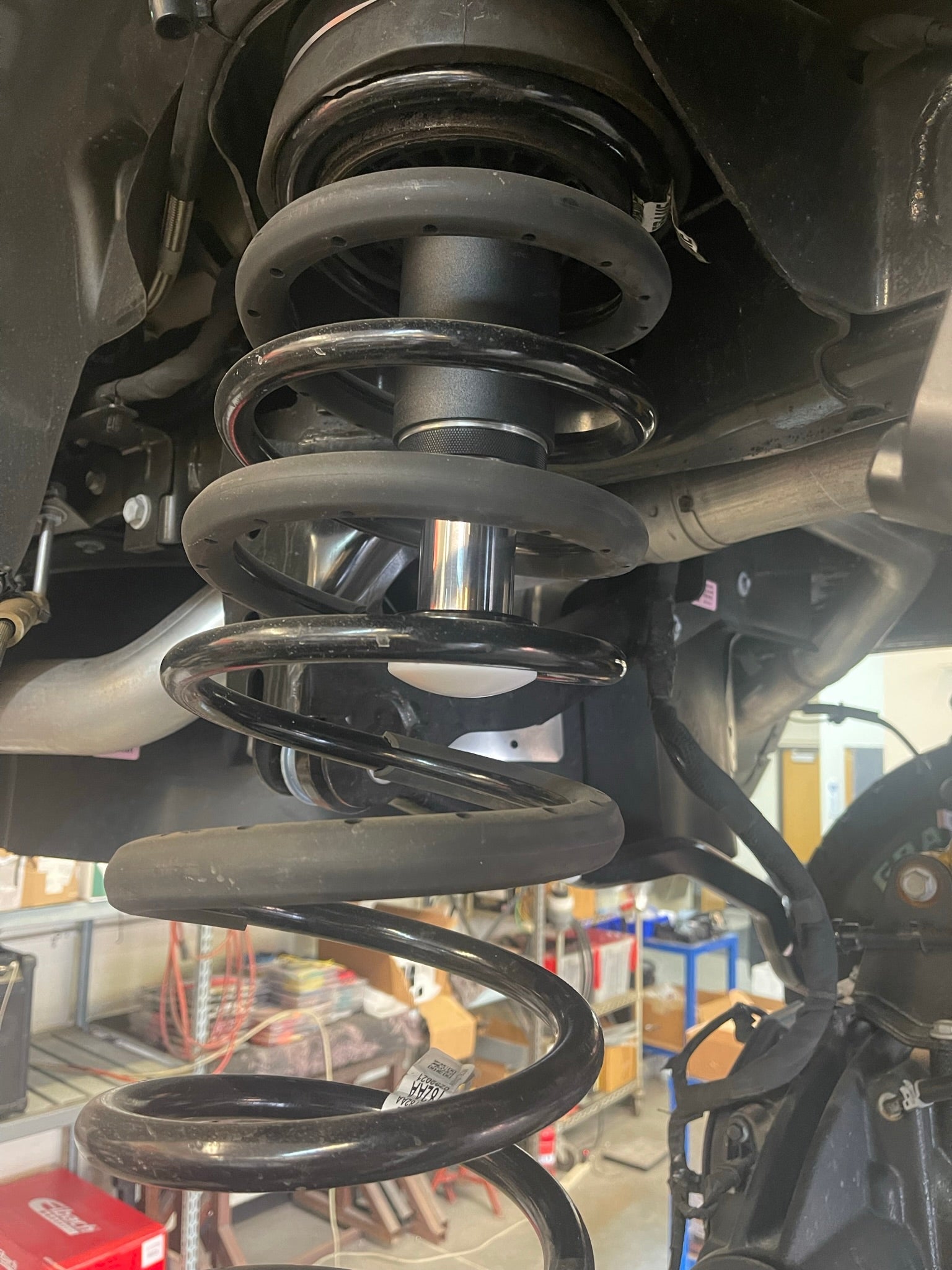 2021 and up Ram TRX rear bump stop kit featuring hydraulic bump stops by Foutz Motorsports, showcasing suspension components.