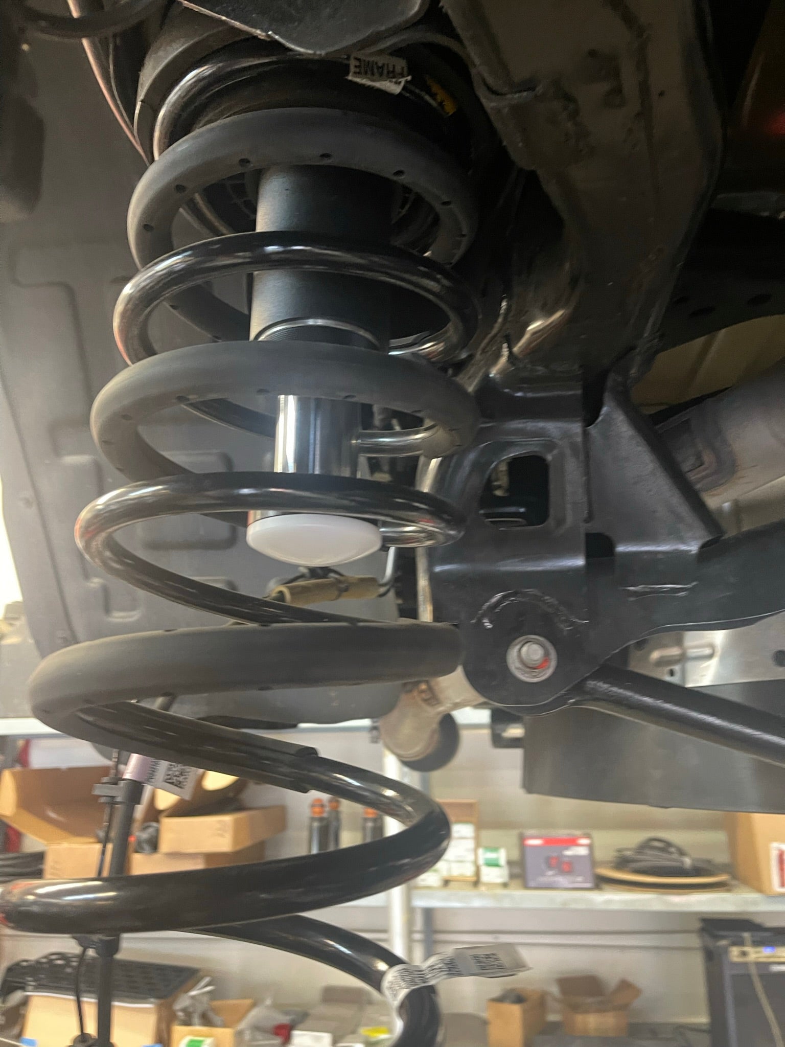 2021 and up Ram TRX rear bump stop kit featuring hydraulic bump stops by Foutz Motorsports, showcasing suspension components.